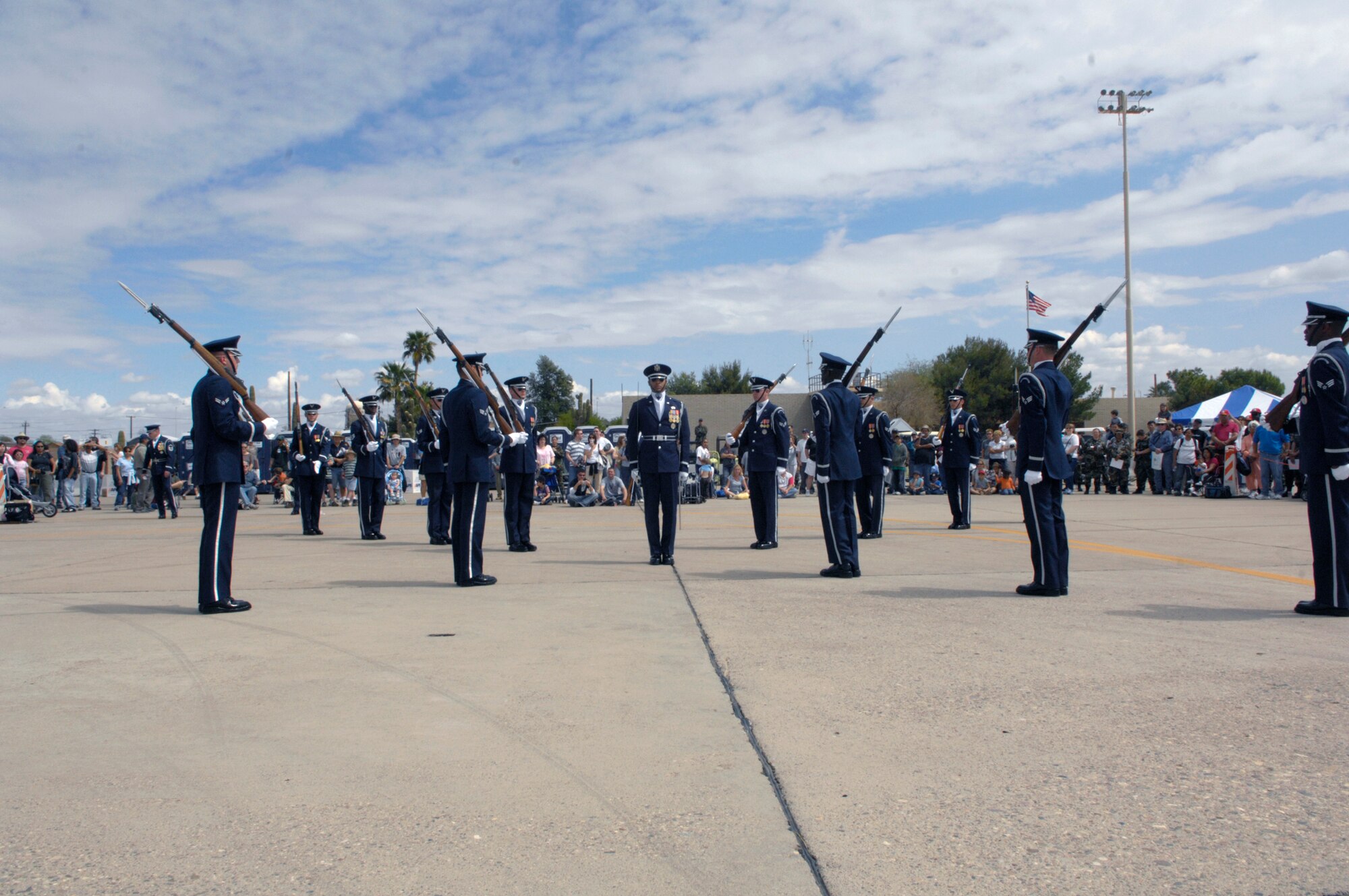 The United States Air Force Honor Guard Drill Team performs March 24 during the Luke Air Force Base, Ariz., air show. The drill team is the traveling component of the Air Force Honor Guard and tours Air Force bases worldwide showcasing the precision of today's Air Force to recruit, retain and inspire Airmen for the Air Force mission. (U.S. Air Force photo/Airman 1st Class Rusti Caraker) 