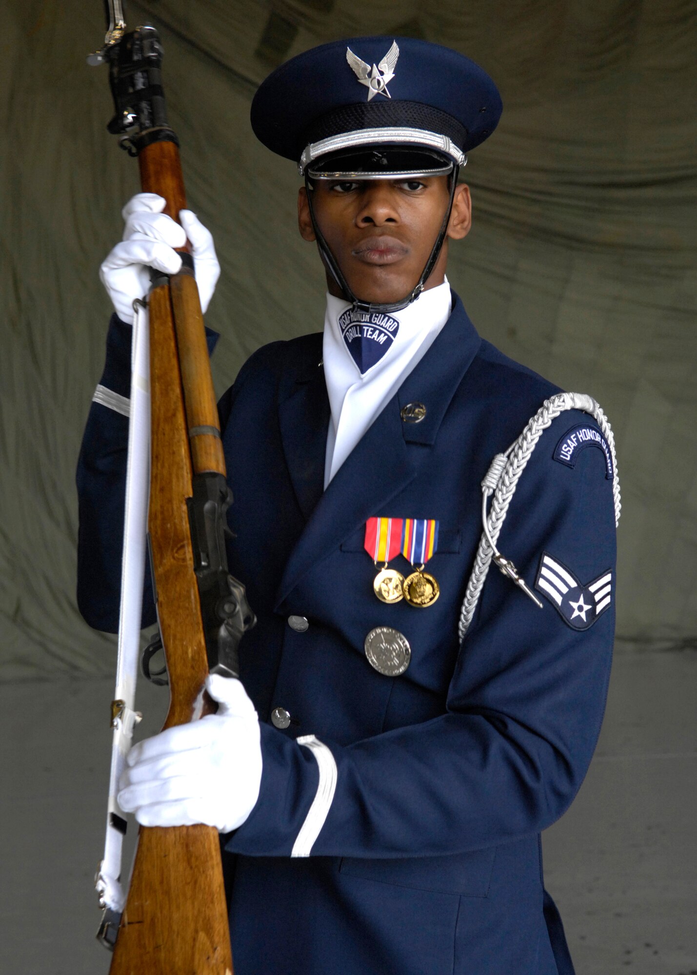 Senior Airman Jermaine James, of the United States Air Force Honor Guard Drill Team, performs March 24 during the air show at Luke Air Force Base, Ariz. The drill team is the traveling component of the Air Force Honor Guard and tours Air Force bases worldwide showcasing the precision of today's Air Force to recruit, retain and inspire Airmen for the Air Force mission. (U.S. Air Force photo/Airman 1st Class Rusti Caraker)