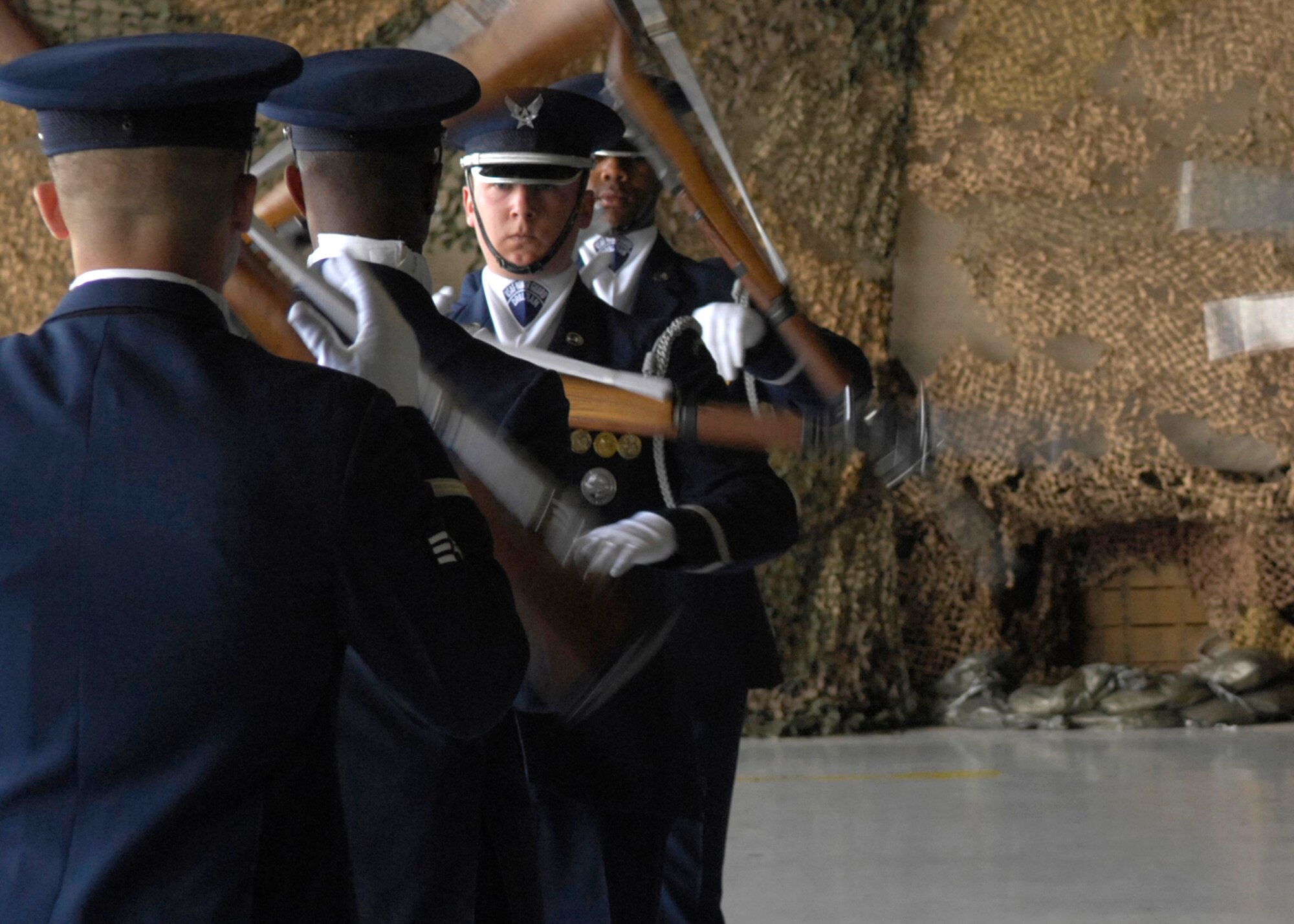 Senior Airman David Leininger, of the United States Air Force Honor Guard Drill Team, performs March 24 during the air show at Luke Air Force Base, Ariz. The drill team is the traveling component of the Air Force Honor Guard and tours Air Force bases worldwide showcasing the precision of today's Air Force to recruit, retain and inspire Airmen for the Air Force mission. (U.S. Air Force photo/Airman 1st Class Rusti Caraker) 