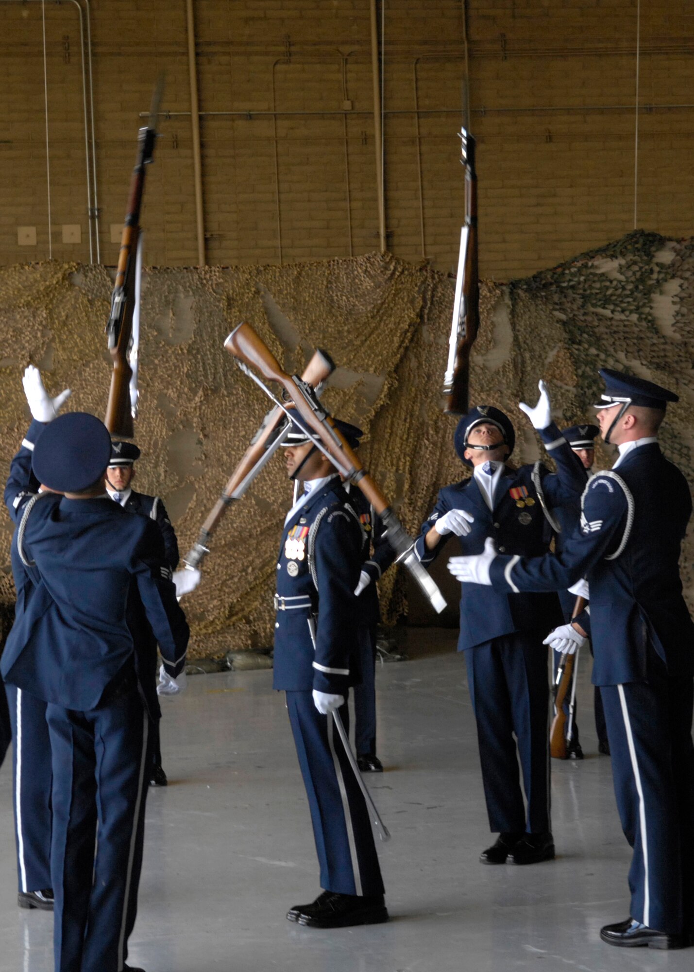 The United States Air Force Honor Guard Drill Team performs March 24 during the Luke Air Force Base, Ariz., air show. The drill team is the traveling component of the Air Force Honor Guard and tours Air Force bases worldwide showcasing the precision of today's Air Force to recruit, retain and inspire Airmen for the Air Force mission. (U.S. Air Force photo/Airman 1st Class Rusti Caraker) 