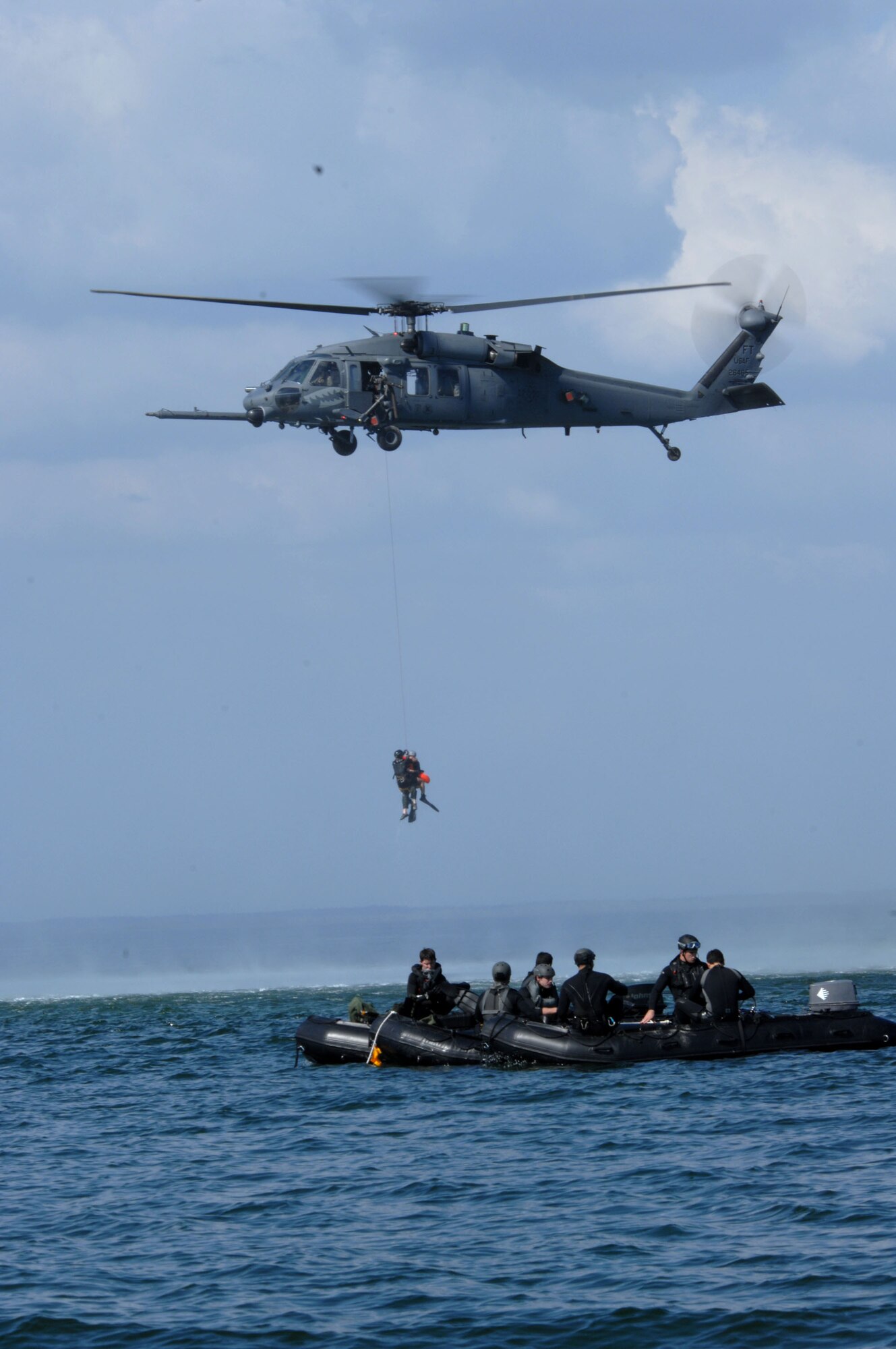 Pararescuemen from the 38th Rescue Squadron are hoisted by an HH-60G Pave Hawk from the 41st RQS, during a dive recovery exercise March 22 in the Gulf of Mexico. The 38th and 41st RQS from Moody Air Force Base, Ga., are taking part in the base's operational readiness exercise, Commando Angel. (U.S. Air Force photo/Senior Airman Joshua T. Jasper) 

