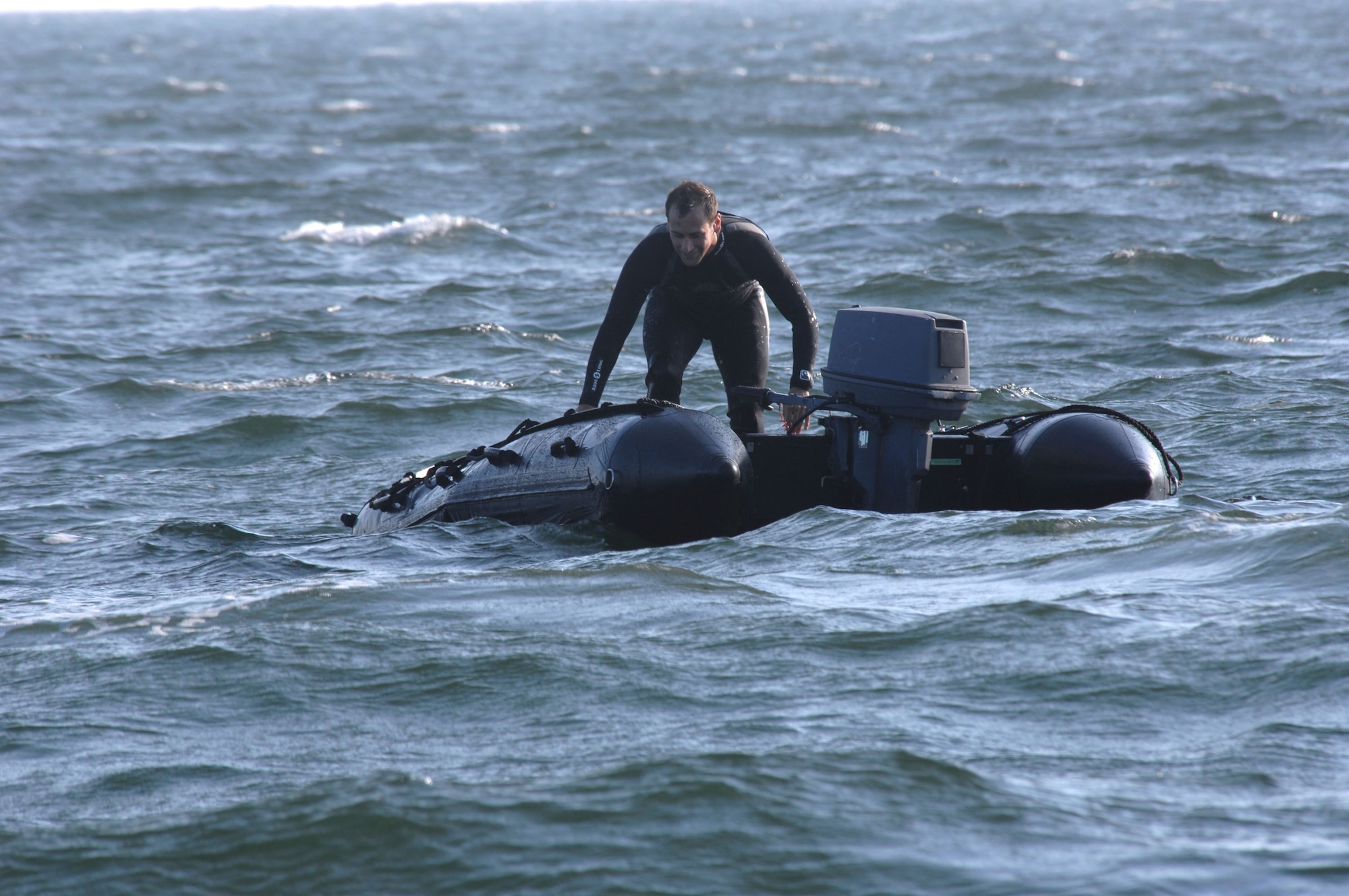 A pararescueman prepares a raft for a survivor during a crash recovery scenario March 22 in the Gulf of Mexico. He is assigned to the 38th Rescue Squadron from Moody Air Force Base, Ga.,  and is taking part in the base's operational readiness exercise, Commando Angel. (U.S. Air Force photo/Senior Airman Joshua T. Jasper) 