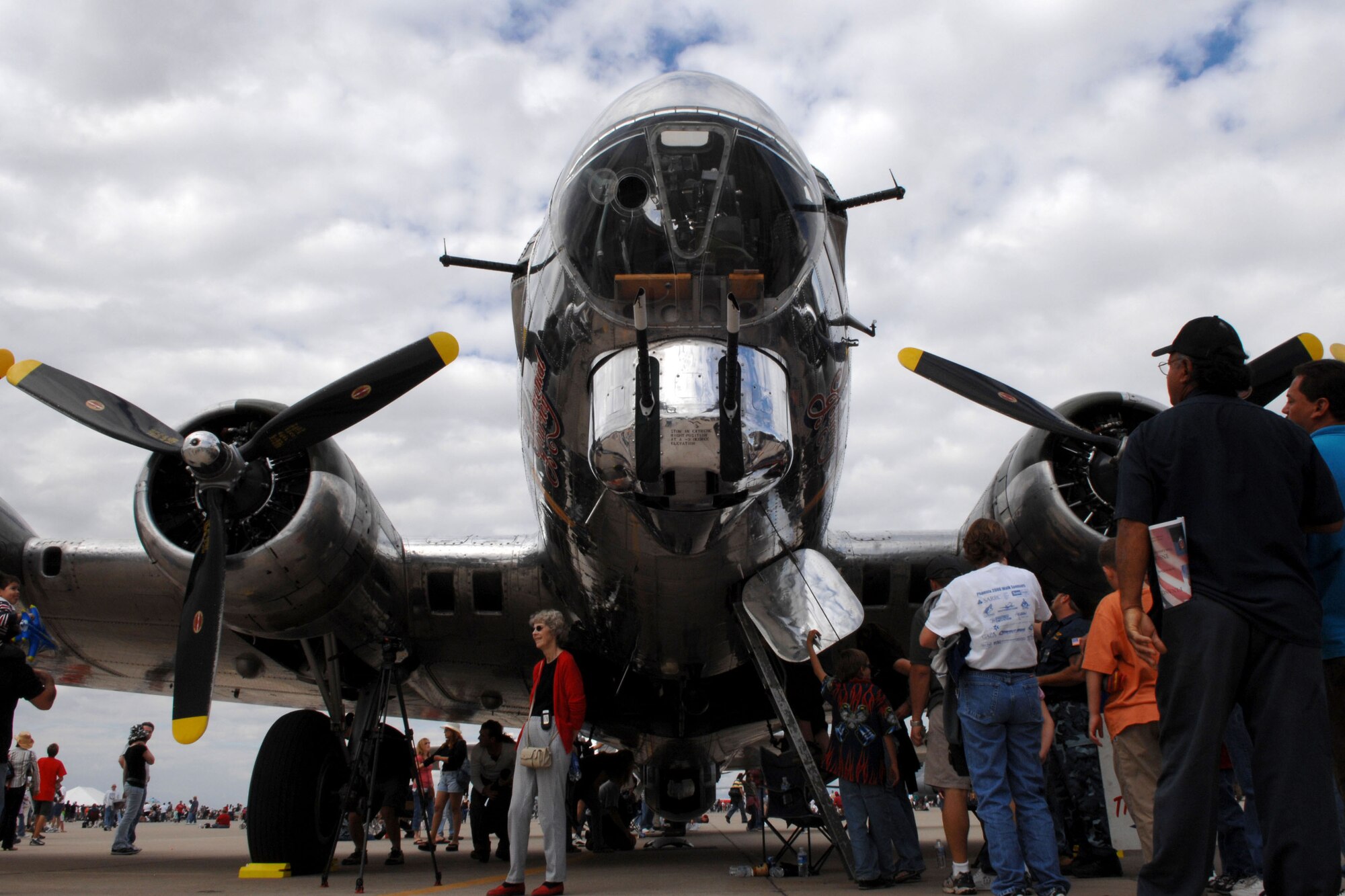 Spectators check out a 1944 B-17 during "The Show of Force 2007, From Heritage to Horizons Air Show" at Luke Air Force Base, Ariz., March 24.  The show was part of Air Force Week, a week-long event designed to highlight the amazing things the Air Force is doing around the globe and to show appreciation to the local community for its support.  (U.S. Air Force photo/Staff Sgt. Brian Ferguson)