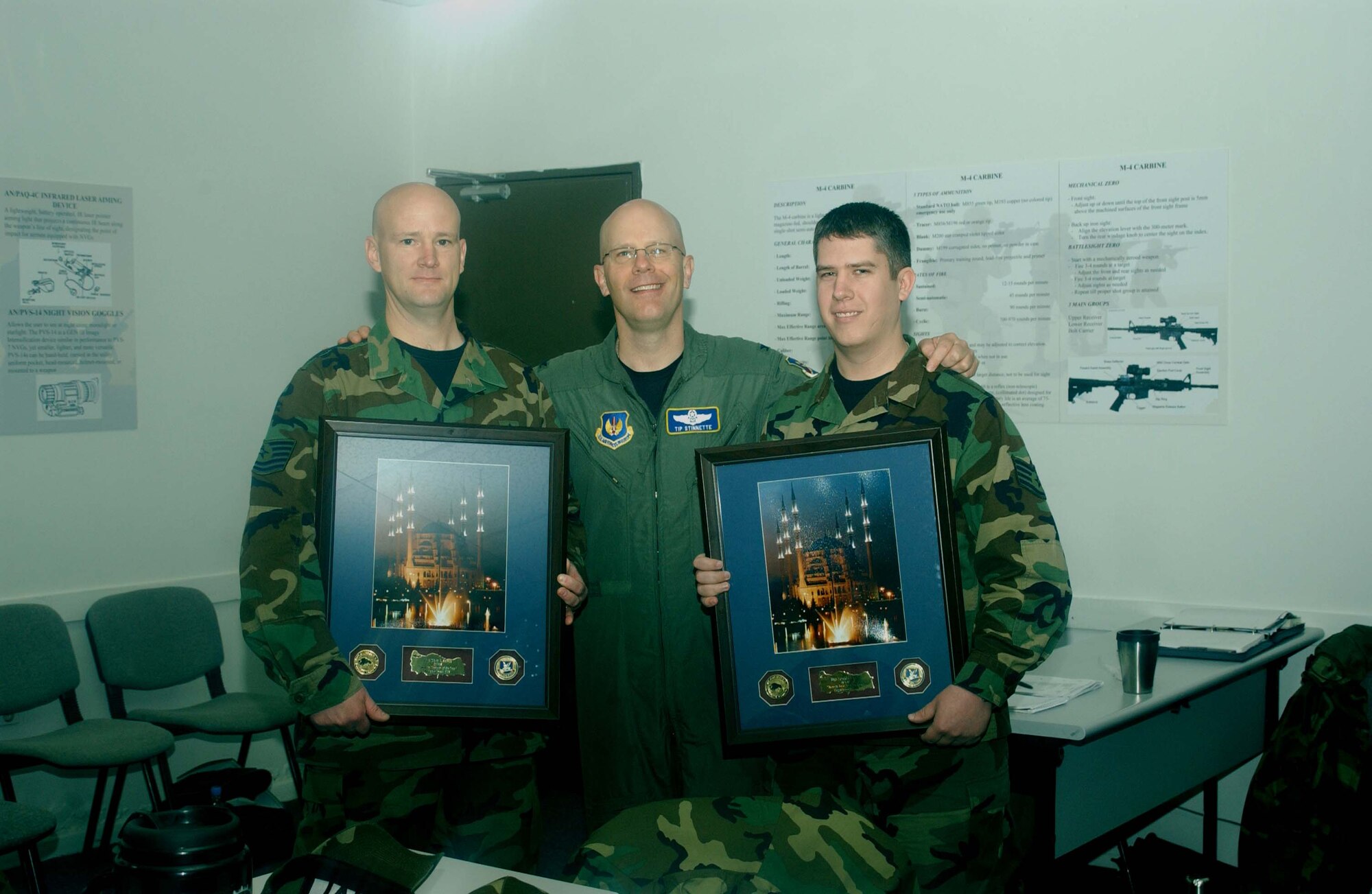 Col. "Tip" Stinnette, 39th Air Base Wing commander, stands between Tech. Sgt. Wade Schutt and Staff Sgt. Travis Baune, 39th Maintenance Squadron security managers, after they received the 39th Air Base Wing Security Manager of the Year program award for 2006. The two Team Incirlik members won the award for managing the best security program on base. 