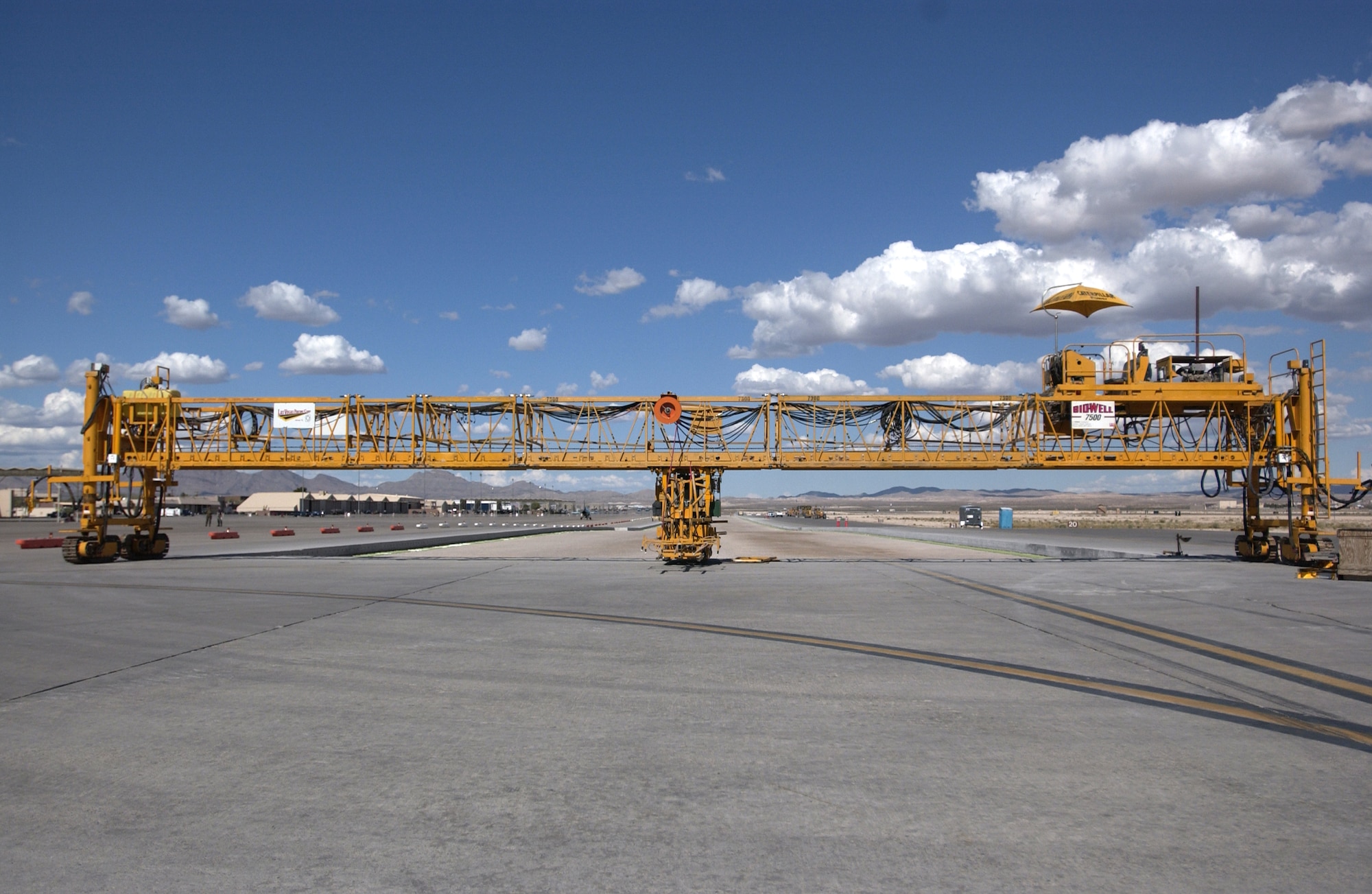A look at the ongoing flight line construction project. Seen is a moble concrete pourer on the southern portion of Taxiway Foxtrot. 
(U.S Air Force Photo/Senior Airman Larry E. Reid Jr.)
