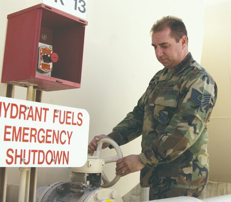 Tech. Sgt. Matthew Meese, 99th Logistics Readiness Squadron NCO in chrage eastside fuels opens a fuel valve in preparation to refuel an aircraft. (U.S. Air Force Photo/Senior AIrman Travis Edwards)