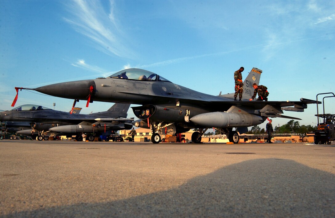 Crew chiefs with the 79th Aircraft Maintenance Unit prepare an F-16 Fighting Falcon to be launched during an operational readiness exercise March 27 at Shaw Air Force Base, S.C. Exercises prepare Airmen for future deployments. (U.S. Air Force photo/Staff Sgt. Nathan Bevier) 