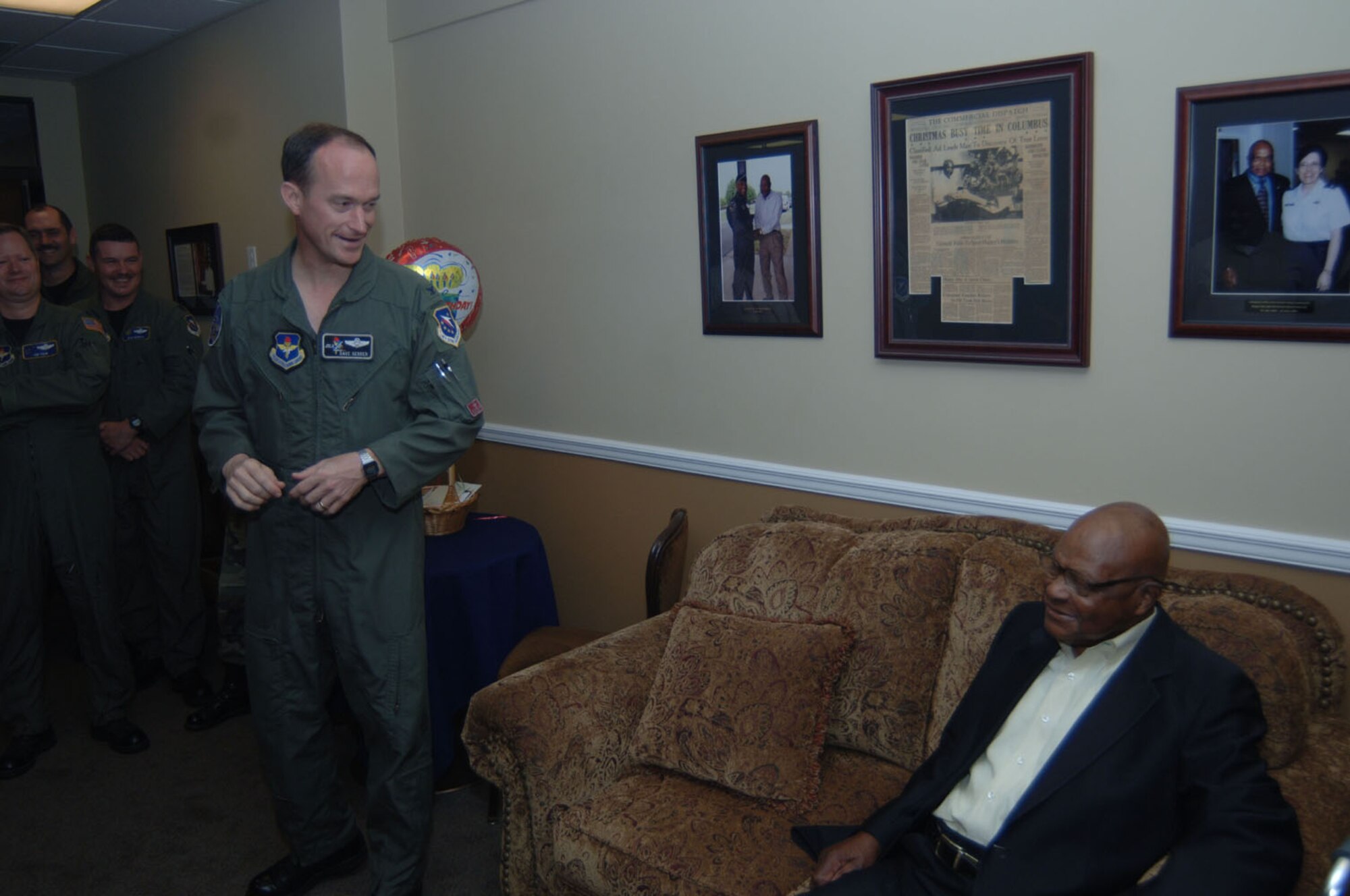 Colonel Dave Gerber, 14th Flying Training Wing commander, wishes Happy Irby a happy birthday in the Happy Lounge of the Columbus Club.  Columbus Air Force Base officials helped him celebrated his 92nd birthday March 27.