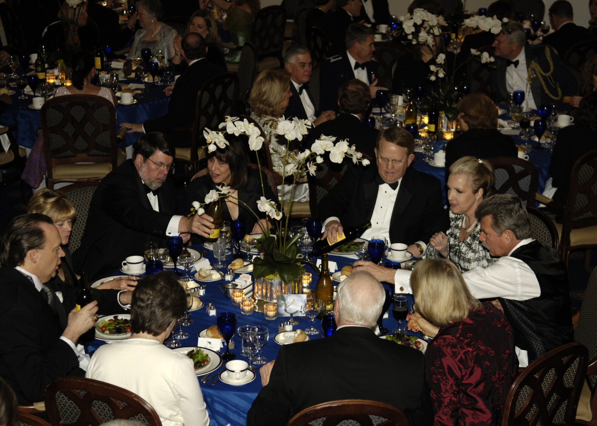 Members of the Air Force community eat a four-course meal prepared by enlisted aides at the fourth annual Air Force Charity Ball March 24 at the Bolling Clubs. (U.S. Air Force photo by Donna H. Parry)