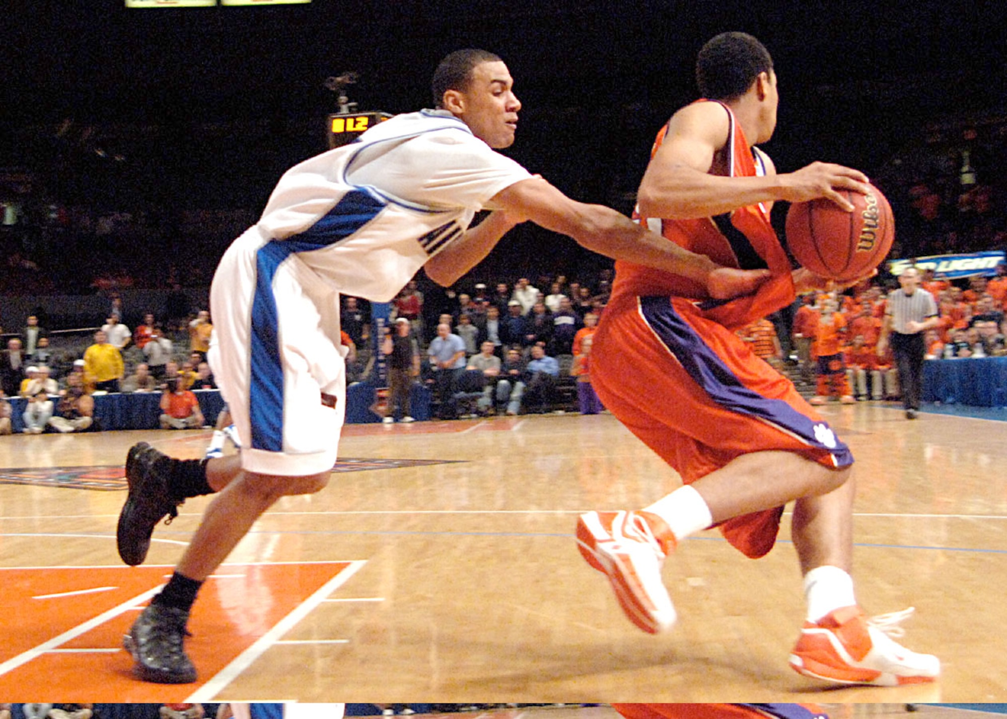 Air Force guard Matt McCraw attempts to steal the ball from Clemson forward David Potter during the National Invitation Tournament semifinal game against Clemson March 27 at Madison Square Garden. Clemson survived a rally by the Falcons in the final minutes to win 68-67 and advance to the NIT championship March 29 against West Virginia. (U.S. Air Force photo/Danny Meyer) 