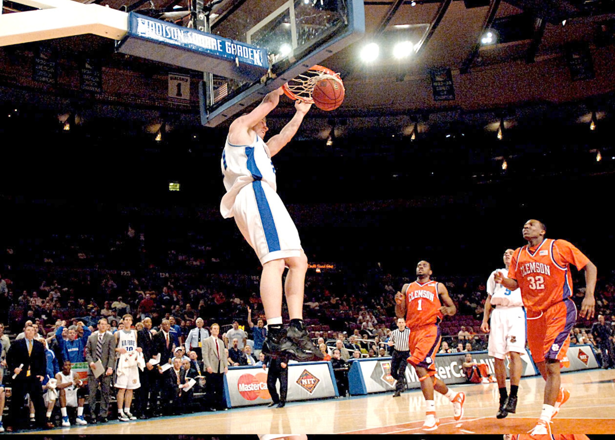 Air Force forward Jake Burtschi throws down a two-hand dunk during the National Invitation Tournament semifinal game against Clemson March 27 at Madison Square Garden. Clemson survived a rally by the Falcons in the final minutes to win 68-67 and advance to the NIT championship March 29 against West Virginia. (U.S. Air Force photo/Danny Meyer) 
