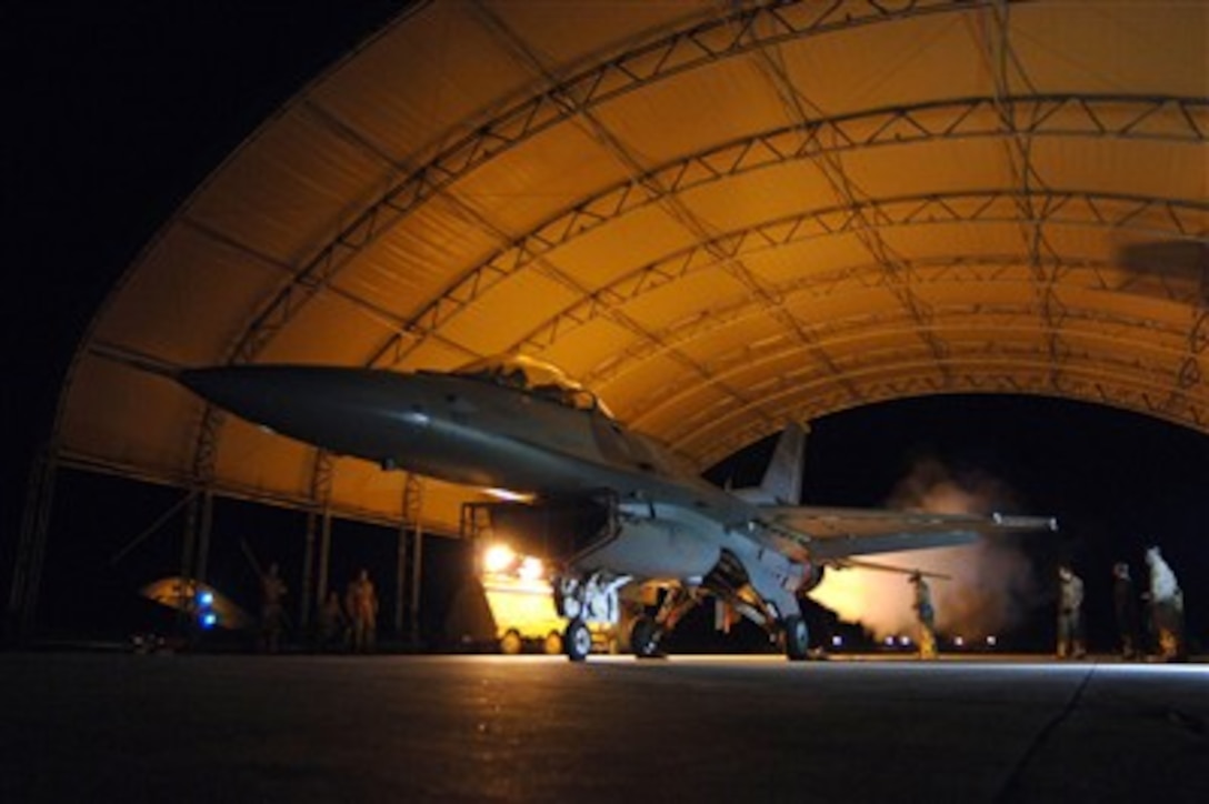 U.S. Air Force airmen of the 332nd Expeditionary Maintenance Squadron conduct a phase post engine run operational check on a F-16 Fighting Falcon at Balad Air Base, Iraq, on March 22, 2007.  Air Force maintenance personnel ensure that all ground and functional checks are accomplished after every 400 flying hours to make sure every aircraft is mission ready.  