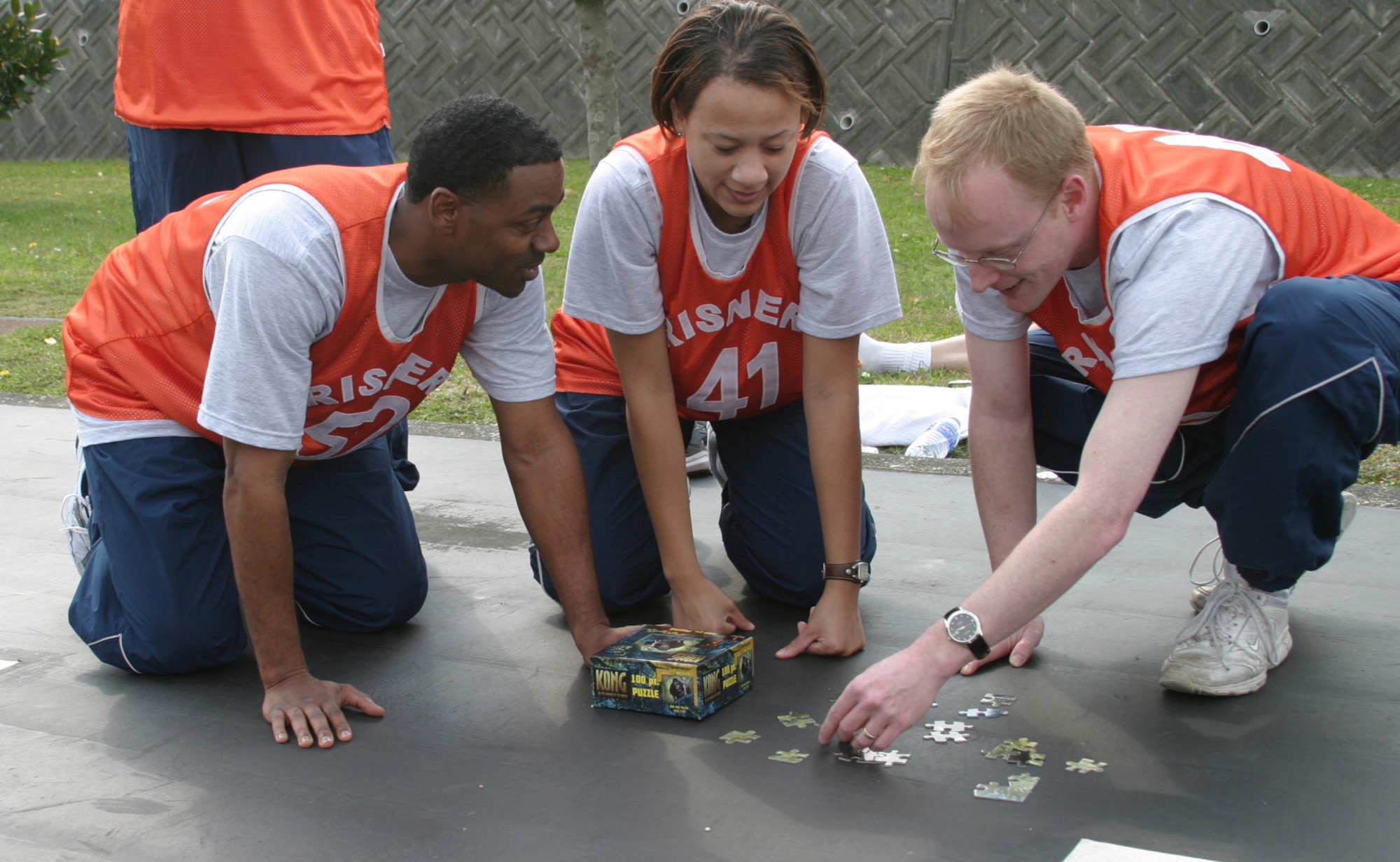 Members from the Erwin NCO Academy Phantom flight assemble a jigsaw puzzle during the puzzle relay phase of the NCO Academy/Airman Leadership School Combat Challenge March 14 on the Erwin Professional Military Education Center grounds. During this phase, members collected a puzzle piece from a pick-up point and delivered the piece to an assembly point until all 100 pieces were collected. This is the first combat challenge between the two schools.  (Air Force/Senior Airman Nestor Cruz)