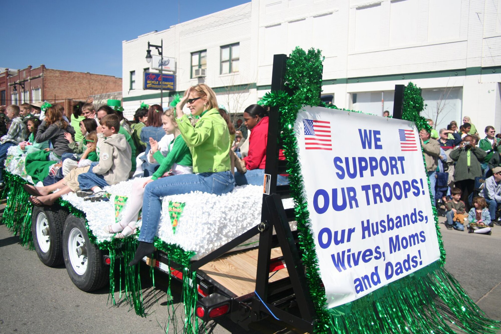 Twenty-eight family members of deployed personnell from McConnell Air Force Base, along with 22 Senior Airmen from the McConnell Airman Leadership School participated in the Wichita St. Patrcik's day parade March 17.  The group was greeted by community members cheering and clapping in support of the Airmen and their loved ones.  (Courtesy photo)