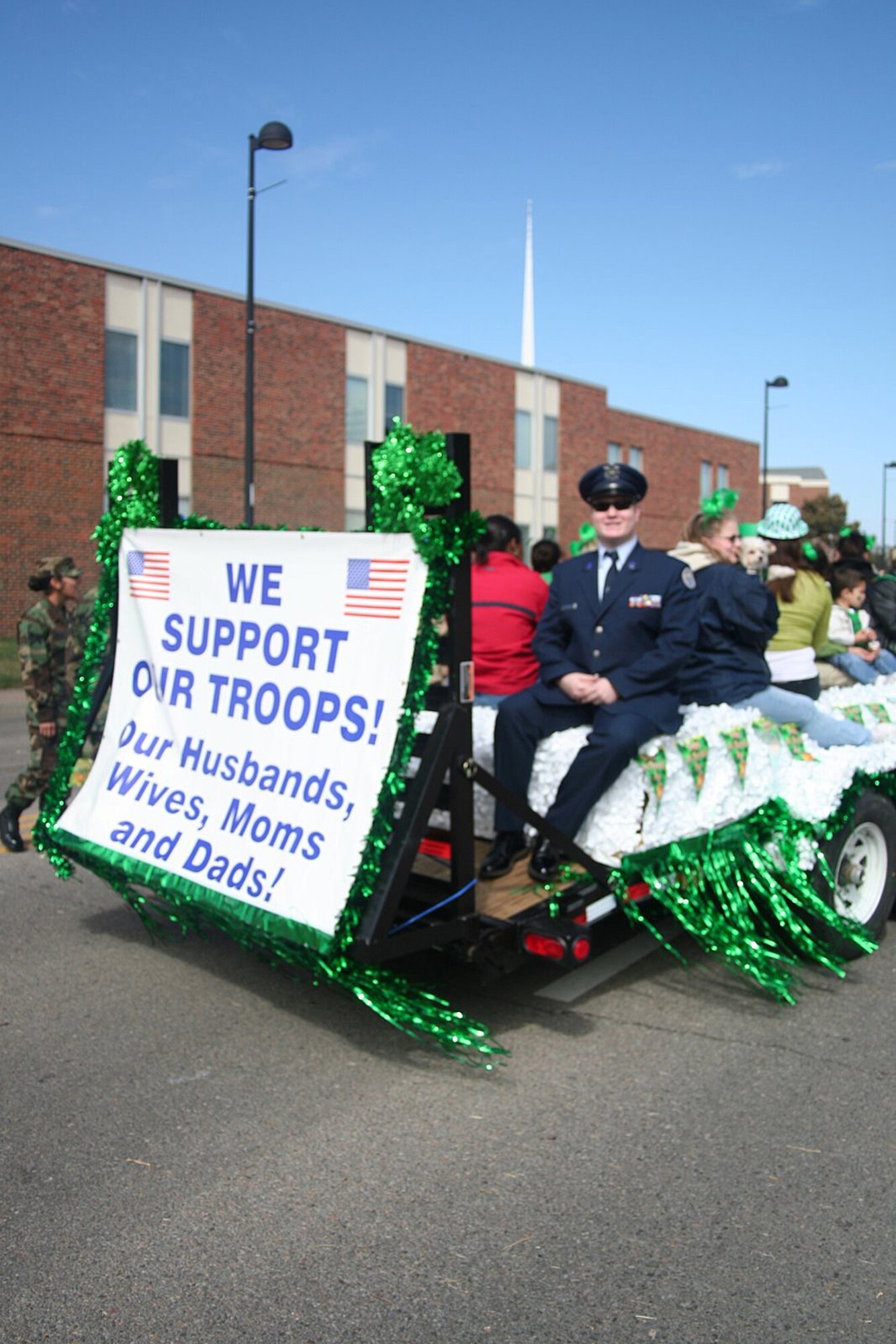 Twenty-eight family members of deployed personnell from McConnell Air Force Base, along with 22 Senior Airmen from the McConnell Airman Leadership School participated in the Wichita St. Patrcik's day parade March 17.  The group was greeted by community members cheering and clapping in support of the Airmen and their loved ones.  (Courtesy photo)