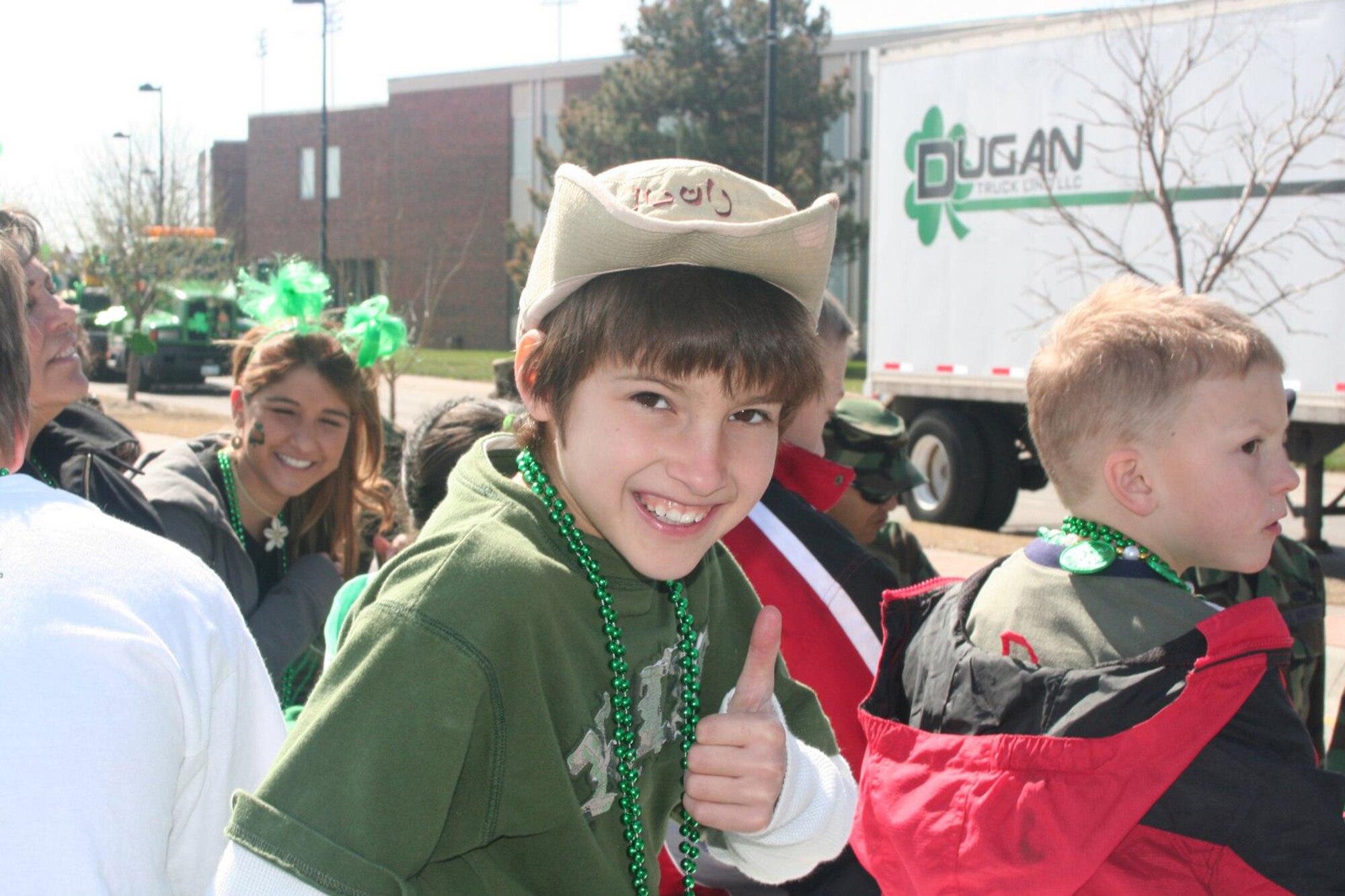 Twenty-eight family members of deployed personnell from McConnell Air Force Base, along with 22 Senior Airmen from the McConnell Airman Leadership School participated in the Wichita St. Patrcik's day parade March 17.  The group was greeted by community members cheering and clapping in support of the Airmen and their loved ones.  (Courtesy photo)