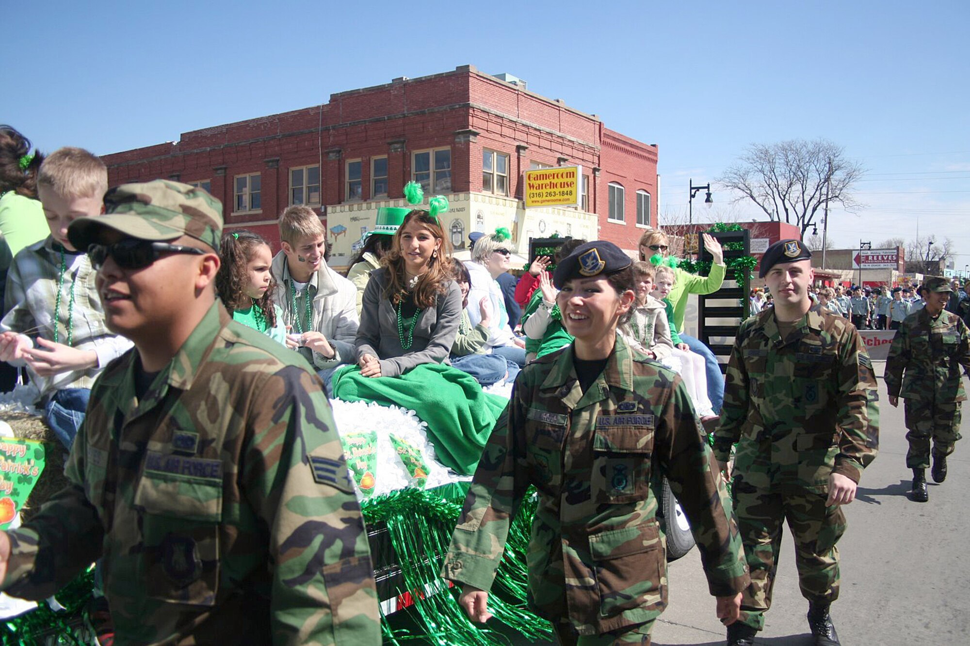 Twenty-eight family members of deployed personnell from McConnell Air Force Base, along with 22 Senior Airmen from the McConnell Airman Leadership School participated in the Wichita St. Patrcik's day parade March 17.  The group was greeted by community members cheering and clapping in support of the Airmen and their loved ones.  (Courtesy photo)