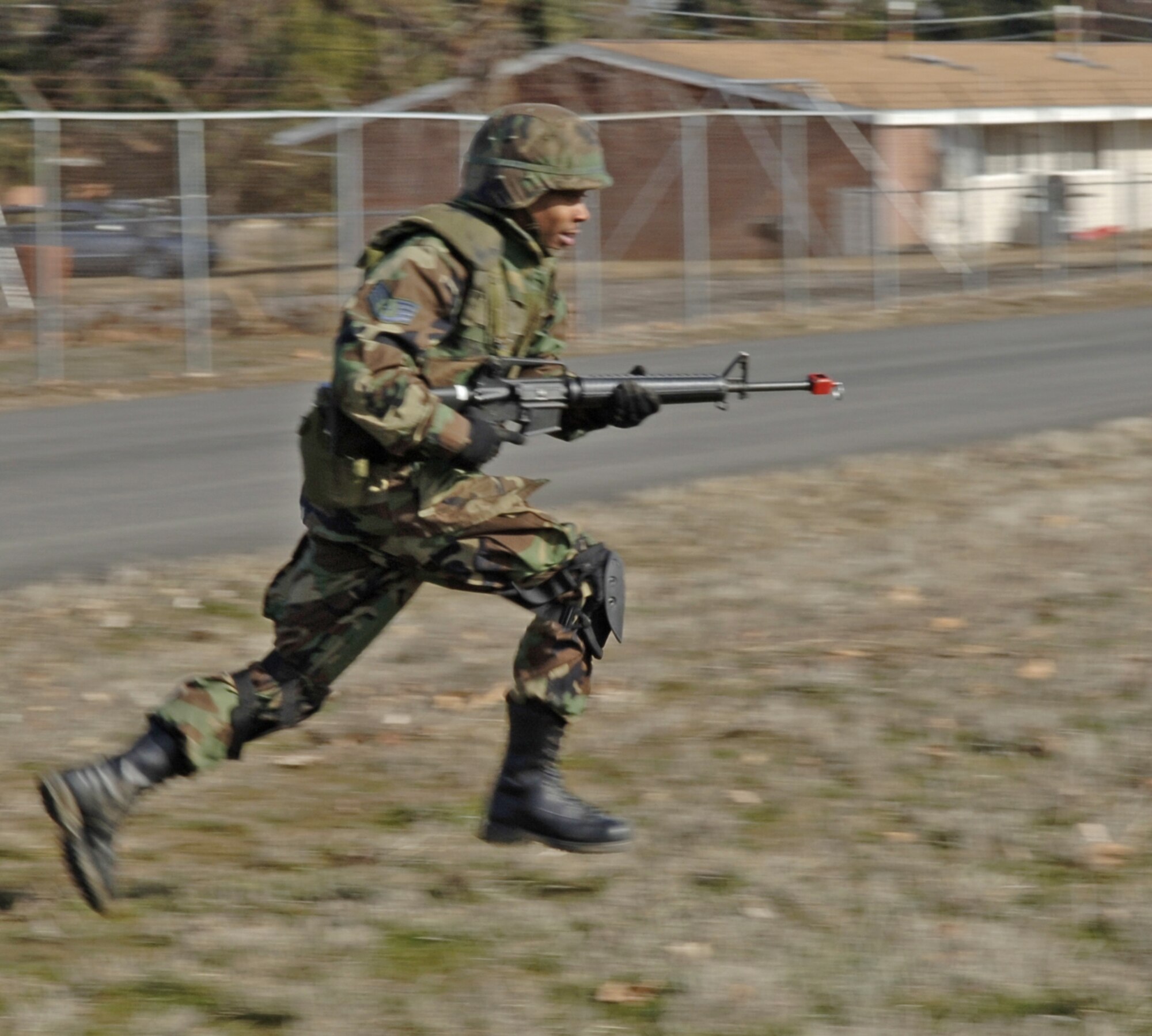 FAIRCHILD AIR FORCE BASE, Wash. -- Staff Sgt. Delton Richardson, 92nd Communications Squadron deployed network administrator, demonstrates how to execute the rush and roll, a combat technique that is taught during the ECST course. ECST is a two-day course aimed toward preparing Airmen scheduled to deploy for a range of situations that may occur during their deployment. Other course topics included basic weapons skills, reporting skills and the use of force. (U.S. Air Force photo/Airman 1st Class Nancy Hooks)