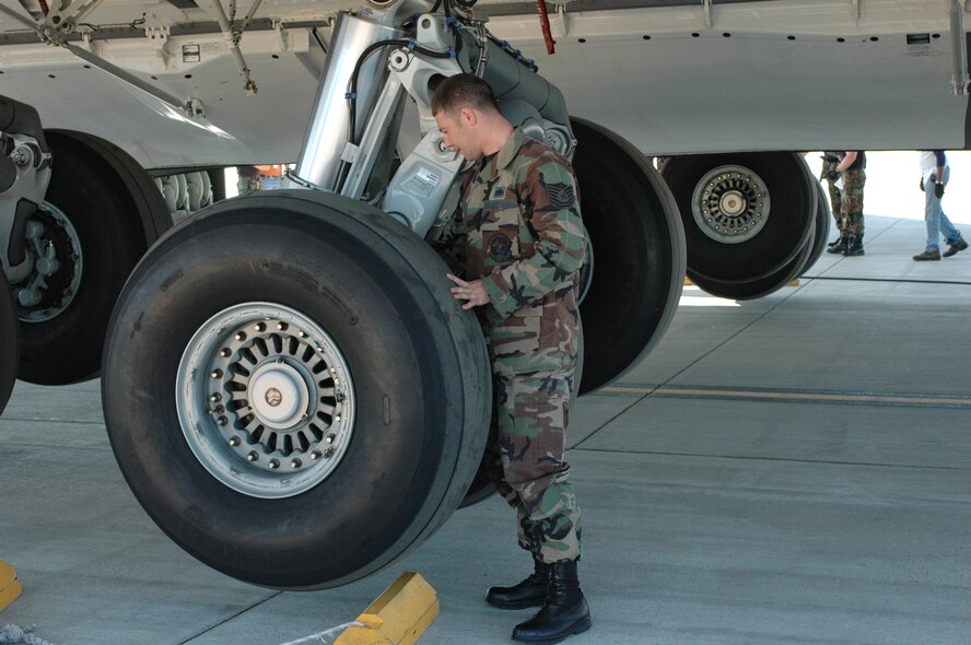 Tech. Sgt. John Carter, 860th Aircraft Maintenance Squadron, prepares to change a C-17 tire on the flight line. Sergeant Carter was chosen as the warrior of the week.