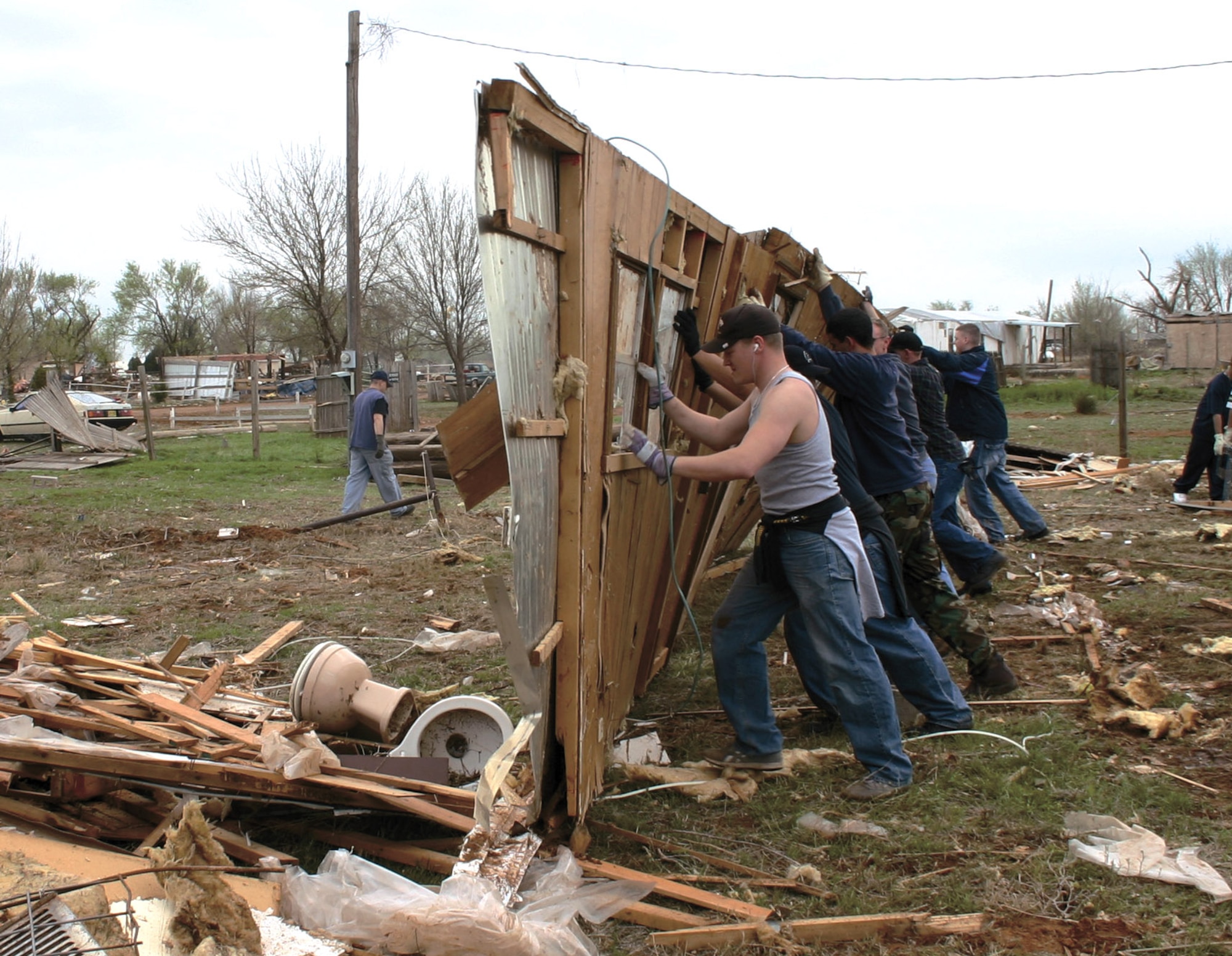 More than 500 Airmen from Cannon Air Force Base have assisted Clovis, N.M., residents in storm clean up. A tornado hit the town, located six miles east of the base, March 23 leaving homes, property and businesses in ruin. Airmen will continue to assist in clean up efforts on an individual basis through the "Airmen for an Afternoon" program. (U.S. Air Force photo/Airman 1st Class Thomas Trower) 