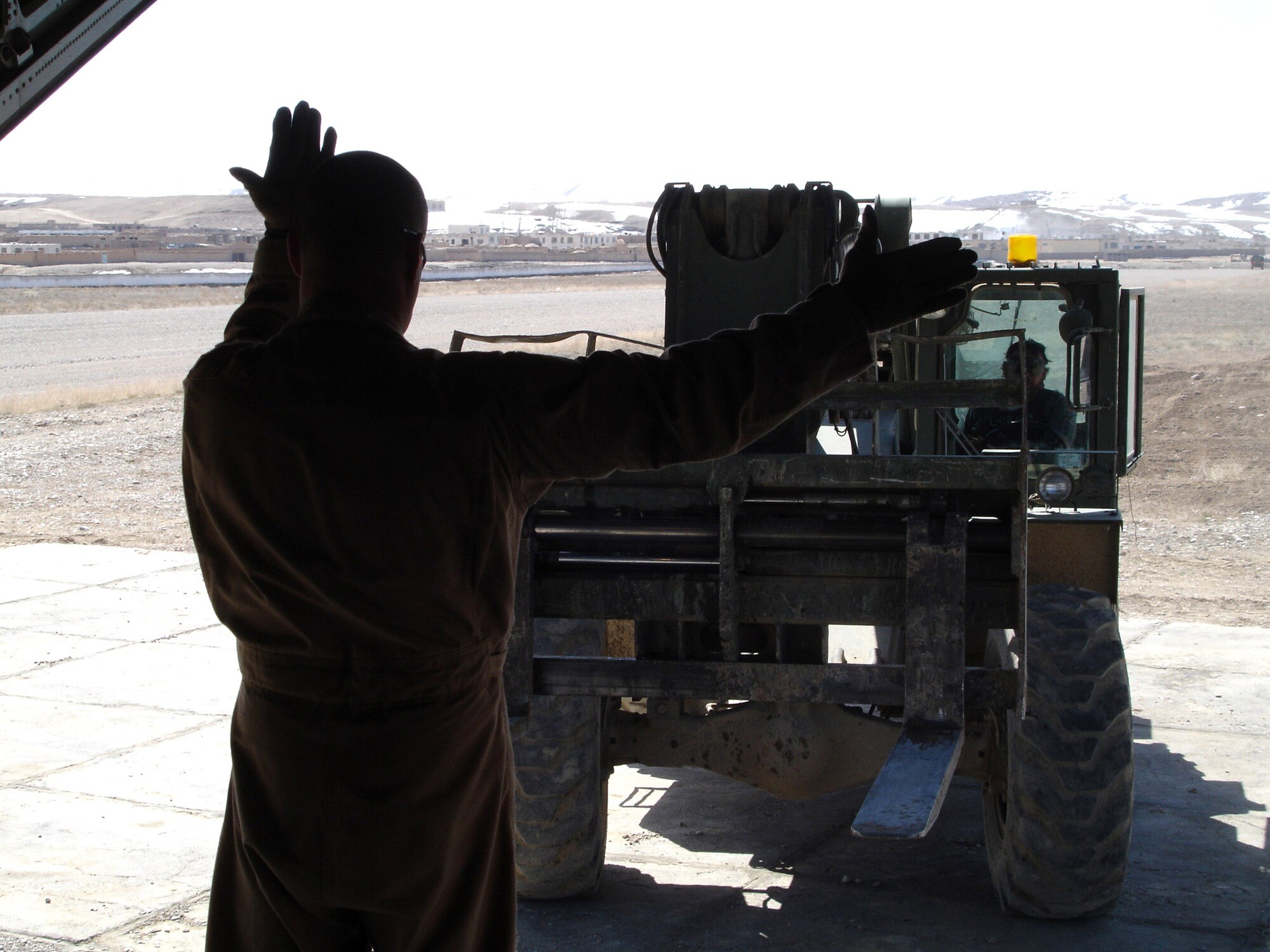 Supplies are loaded onto a C-130 Hercules at Bagram Air Base, Afghanistan, March 27, that later will be airdropped to U.S. ground forces supporting Operation Enduring Freedom.  (U.S. Air Force photo/Chief Master Sgt. Mike Annis)
