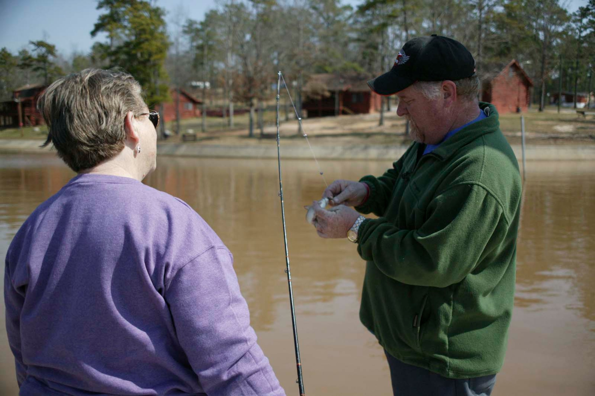 CAMDEN, S.C. -- Terry Rogers, Wateree Recreation Area manager, helps Betty Murphy release a fish March 9 at the recreation area. The 25-acre area holds endless possibilities for all Department of Defense identification cardholders. (U.S. Air Force photo/Senior Airman Holly MacDonald)