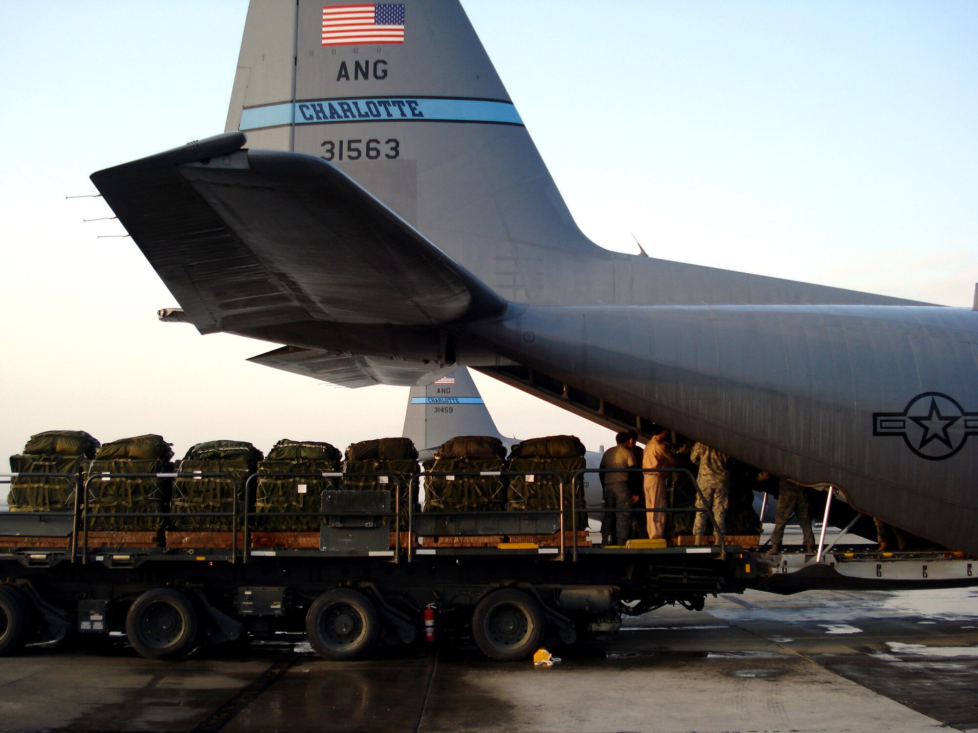 Supplies are loaded onto a C-130 Hercules at Bagram Air Base, Afghanistan, March 27, that later will be airdropped to U.S. ground forces in support of Operation Enduring Freedom.  (U.S. Air Force photo/Chief Master Sgt. Mike Annis)