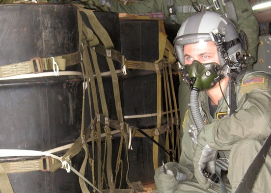 Airman 1st Class Joshua Coda prepares to release cargo March 24 during a training mission at Andersen Air Force Base, Guam. Aircrews are learning to use the Global Positioning System technology drop sondes to more accurately airdrop cargo. Airman Coda is a loadmaster with the 36th Airlift Squadron at Yokota Air Base, Japan. (U.S. Air Force photo/Airman 1st Class David Clark)