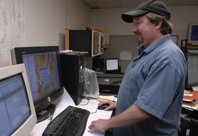 Robert Brabant, terminal instrament procedures manager for the Nellis Air Traffic Control Facility, updates maps and procedures daily. Mr. Brabant runs the only base-leve terminal intrament procedures office in Air Combat Command. His job is to ensure operations on conducted safely. (U.S. Air Force photo/Airman 1st Class Kasabyan McGarvey)