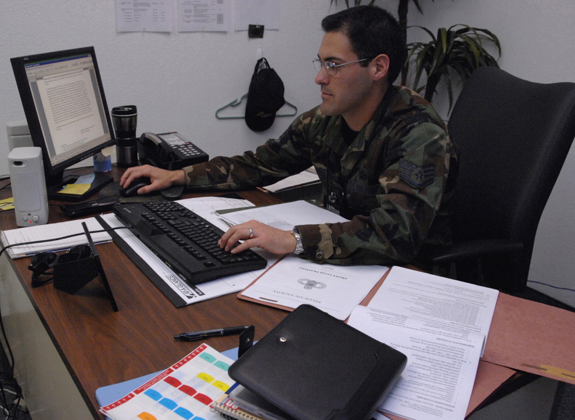 Staff Sgt. Robert Gonzales, non-commissioned officer in charge of air traffic control training, monitors all training daily for the Nellis Air Traffic Control Facility. The training is almost continuous throughout the controllers career. (U.S. Air Force photo/Airman 1st Class Kasabyan McGarvey)