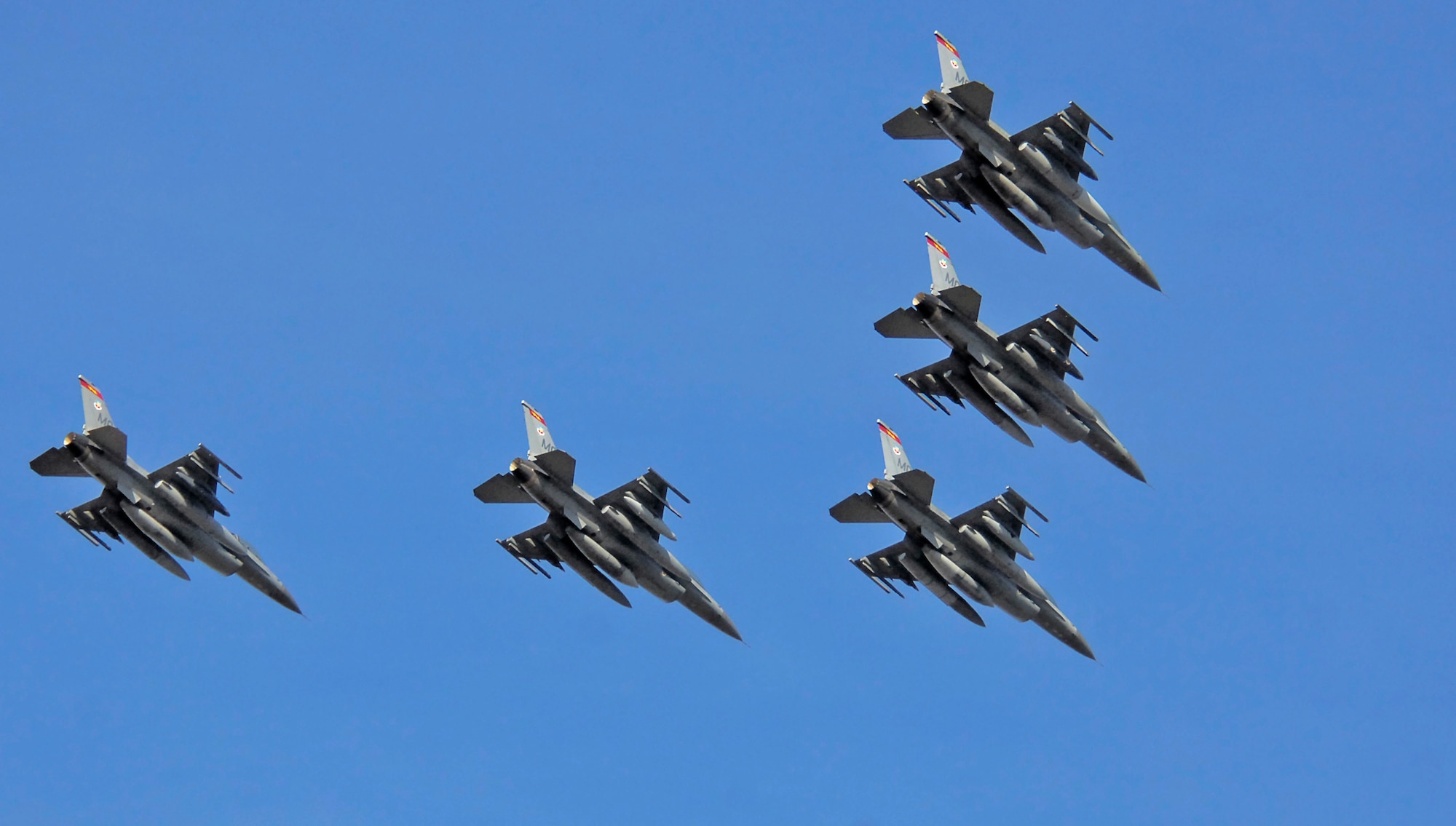 MOUNTAIN HOME AIR FORCE BASE, Idaho -- In a symbolic goodbye to the base, the 389th Fighter Squadron’s last five F-16s soar over the base’s flightline for the last time as they marked the completion of a five-month plan to move the these jets to McEntire Air National Guard Base, S.C., and Nellis Air Force Base, Nev. The move, outlined in the 2005 Base Realignment and Closure recommendations, consolidates the service’s F-15 and F-16 fighter aircraft at selected bases. Air Force photo by Airman 1st Class Ryan Crane