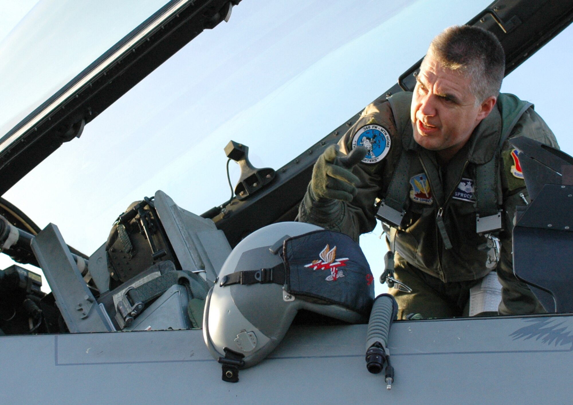 MOUNTAIN HOME AIR FORCE BASE, Idaho -- Lt. Col. Phillip “Sprocket” Hoover, former 389th Fighter Squadron commander, speaks with his crew chief while running through his pre-flight check list March 29. Colonel Hoover piloted one of the squadron’s last five F-16s as they left the base that morning to complete a five-month plan to move the these jets to McEntire Air National Guard Base, S.C., and Nellis Air Force Base, Nev. The move was outlined in the 2005 Base Realignment and Closure recommendations to consolidate the service’s F-15 and F-16 fighter aircraft at selected bases. Air Force photo by Airman 1st Class Ryan Crane
