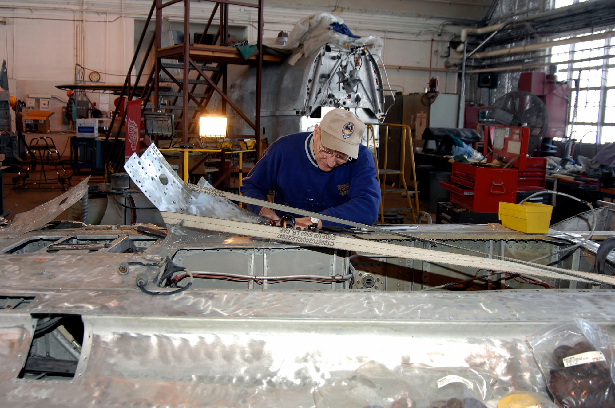 DAYTON, Ohio (02/2007) -- Volunteer Leroy Hendrickson works on the Japanese George aircraft wing in the restoration hangar at the National Museum of the U.S. Air Force. (U.S. Air Force photo)