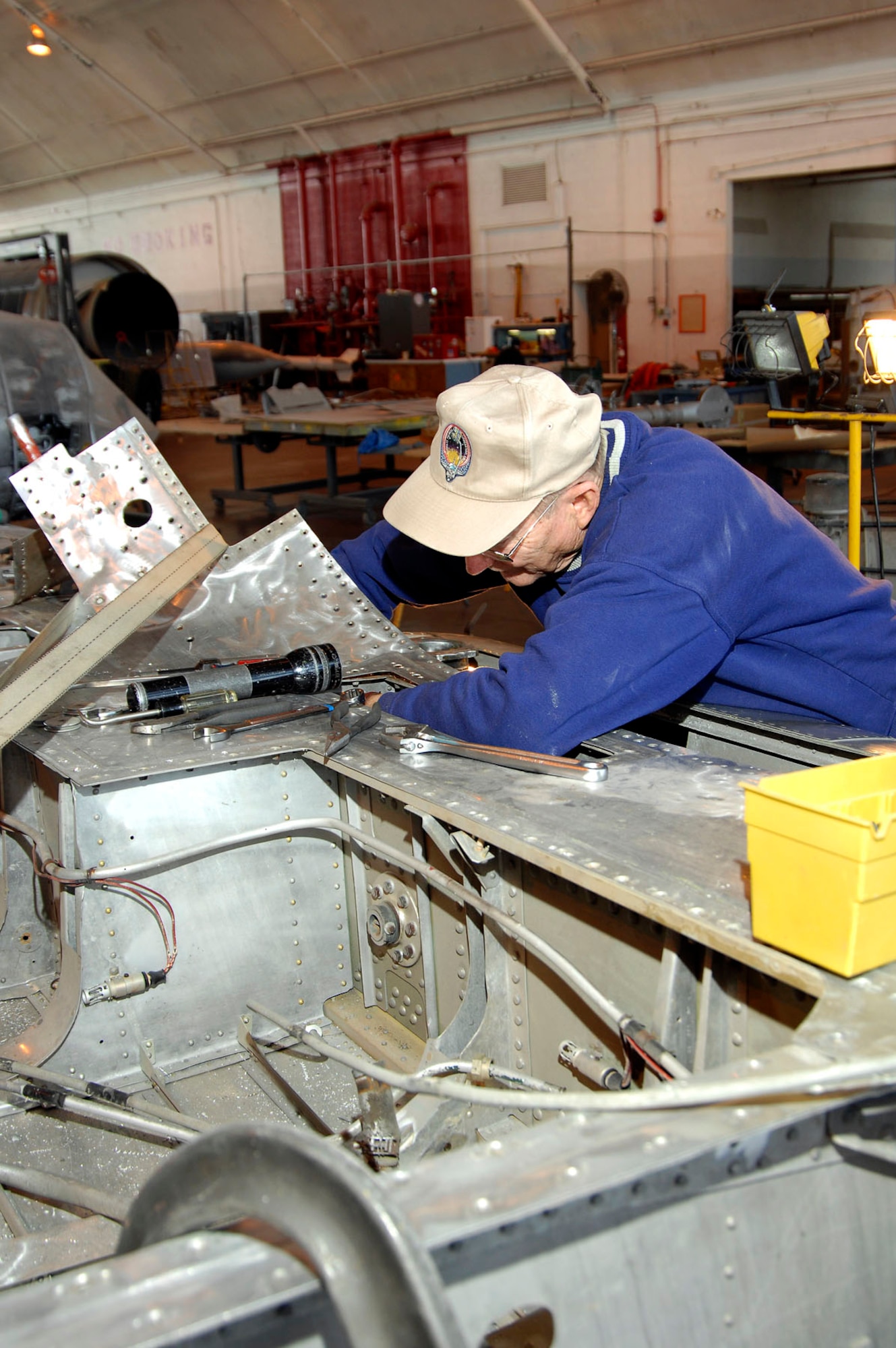 DAYTON, Ohio (02/2007) -- Volunteer Leroy Hendrickson works on the Japanese George aircraft wing in the restoration hangar at the National Museum of the U.S. Air Force. (U.S. Air Force photo)