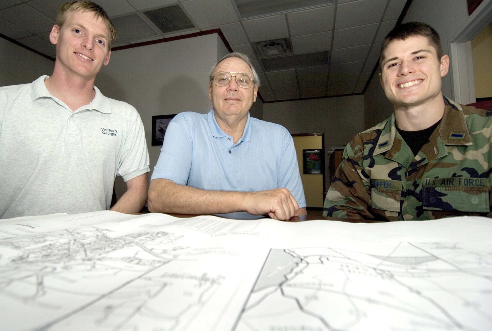 (From left) Stephen Sparks, Howard Dodds and 1st Lt. Joe Schieffer, members of the 23rd Contracting Squadron infrastructure flight, were recently awarded the 2006 Air Force Special Recognition Award for Multiple Award Construction Team. The flight won their award for their ability to implement a new system to streamline acquistion practices. (U.S. Air Force photo by Staff Sgt. Manuel Martinez)