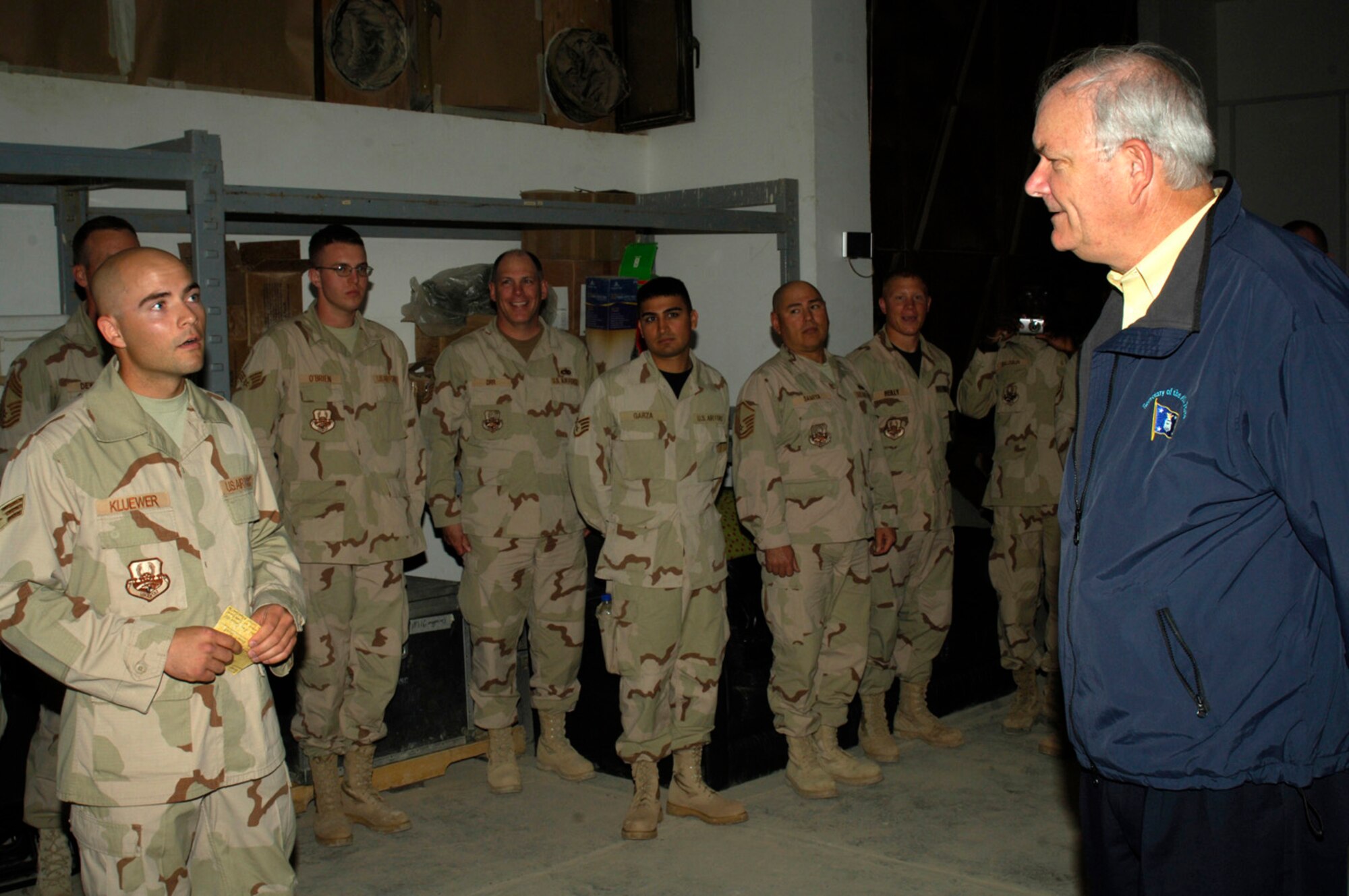 (ALI BASE, IRAQ) Honorable Michael Wynne, Secretary of the Air Force, receives a briefing from Senior Airman Byron Kluewer, 407th Air Expeditionary Group, during the Secretary's tour here Mar 28. (Courtesy photo)