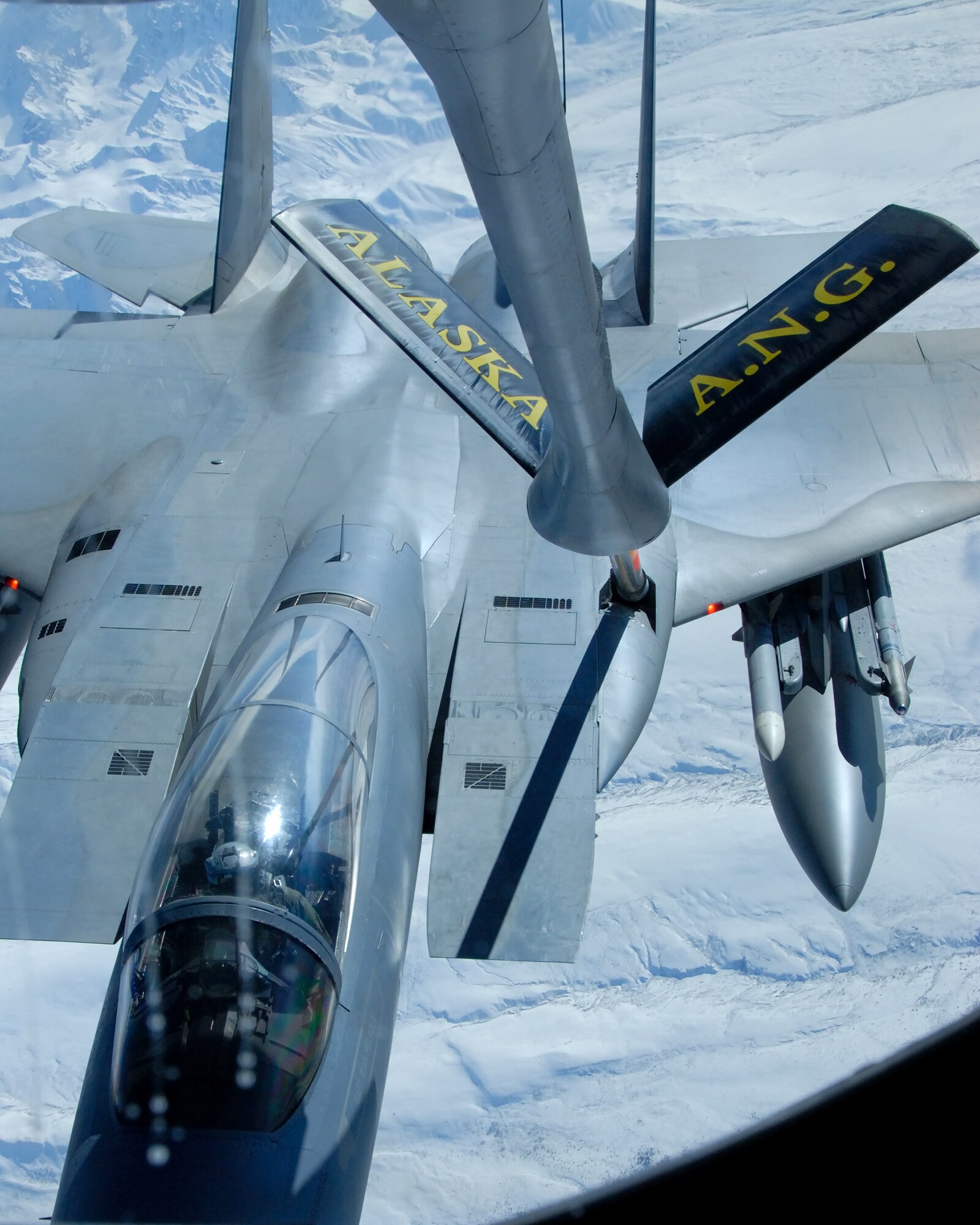 A 12th Fighter Squadron F-15 Eagle from Elmendorf Air Force Base, Alaska, refuels behind a KC-135 Stratotanker March 26 over the Pacific Alaska Range Complex. The KC-135 is from the 168th Air Refueling Squadron at Eielson AFB, Alaska. Nearly all internal fuel, up to 200,000 pounds, can be pumped through the flying boom, the KC-135's primary fuel transfer method. (U.S. Air Force photo/Master Sgt. Robert Wieland) 