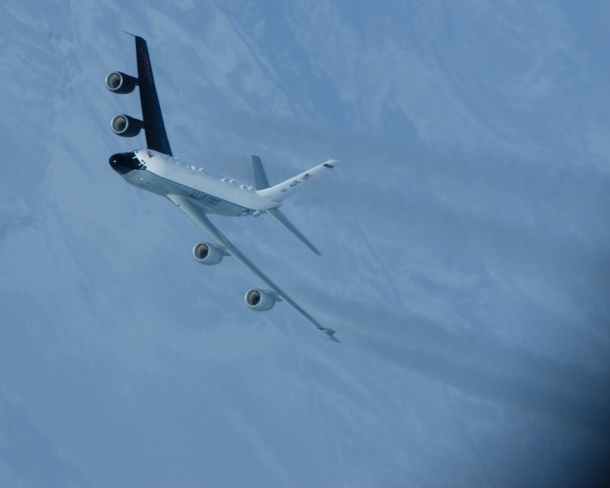 An RC-135 Cobra Ball from the 55th Reconnaissance Wing at Offutt Air Force Base, Neb., veers away from a KC-135 Stratotanker after being refueld March 26 over the Pacific Alaska Range Complex. (U.S. Air Force photo/Master Sgt. Robert Wieland) 