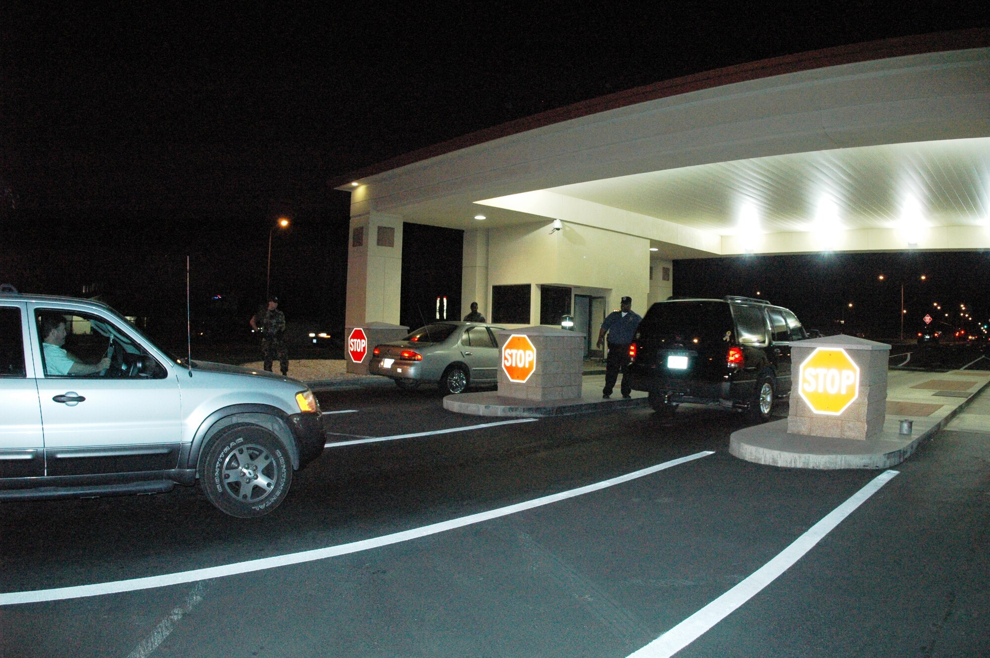 Motorists stop at Travis’ Main gate before gaining access to the base March 23. (U.S. Air Force photo by Tech. Sgt. Donald Osborn)