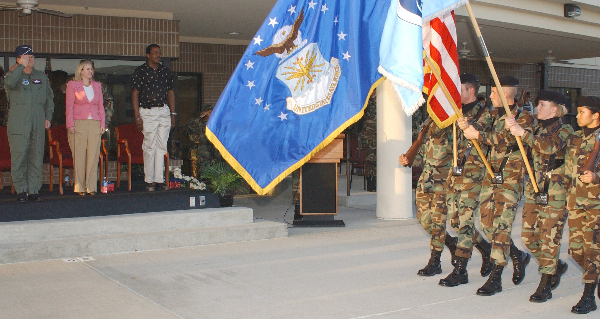 From left, Brig. Gen. Richard Moss, 403rd Wing commander; Parah Fishburn from Sen. Thad Cochran’s office and Bill Stallworth, Biloxi Ward 2 councilman, watch 335th Training Squadron students march in the 81st Training Group parade March 22.  General Moss was the reviewing officer and Ms. Fishburn and Mr. Stallworth were honorary commanders.  (U.S. Air Force Photo by Kemberly Groue)
