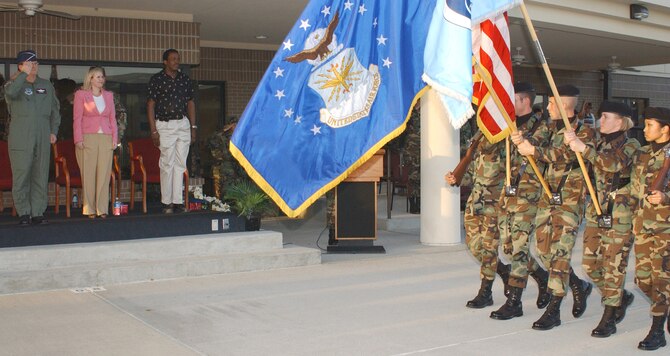 From left, Brig. Gen. Richard Moss, 403rd Wing commander; Parah Fishburn from Sen. Thad Cochran’s office and Bill Stallworth, Biloxi Ward 2 councilman, watch 335th Training Squadron students march in the 81st Training Group parade March 22.  General Moss was the reviewing officer and Ms. Fishburn and Mr. Stallworth were honorary commanders.  (U.S. Air Force Photo by Kemberly Groue)
