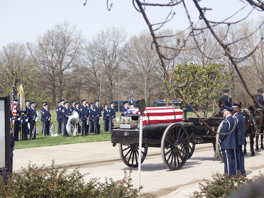 The U.S. Air Force Band's Ceremonial Brass performs a full-honors funeral at Arlington National Cemetery. (U.S. Air Force photo)