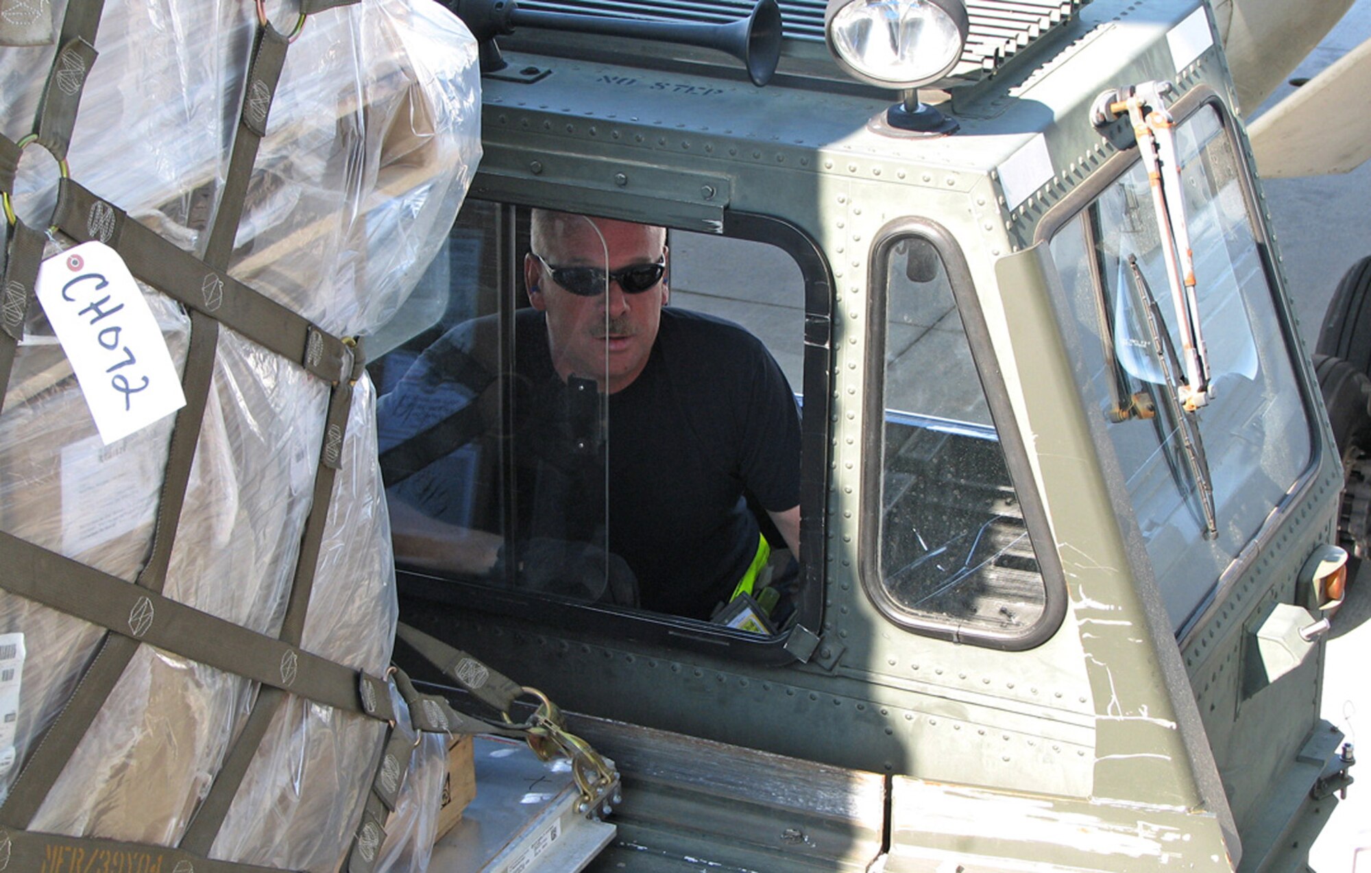 Staff Sgt. William Daniels, 53rd Aerial Port Squadron air transportation craftsman, drives a 60k loader on the flightline during the Patriot Partner Exercises Program. The program brought nearly 150 aerial port reservists to the base to work side-by-side with their active-duty counterparts. For the full story see Page 5. (U.S. Air Force photo by Chief Master Sgt. Wayne Hall)