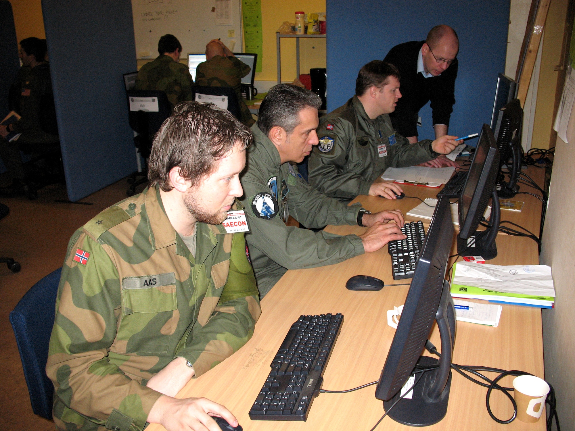 Joint Warfare Center staff members participate in Exercise Enabler 2007, a virtual exercise that tested new tools for future JWC exercises March 28 at Ramstein Air Base, Germany. The exercise prepares NATO battle staff members for deployments to Afghanistan. (U.S. Air Force photo/Staff Sgt. Leigh Bellinger)