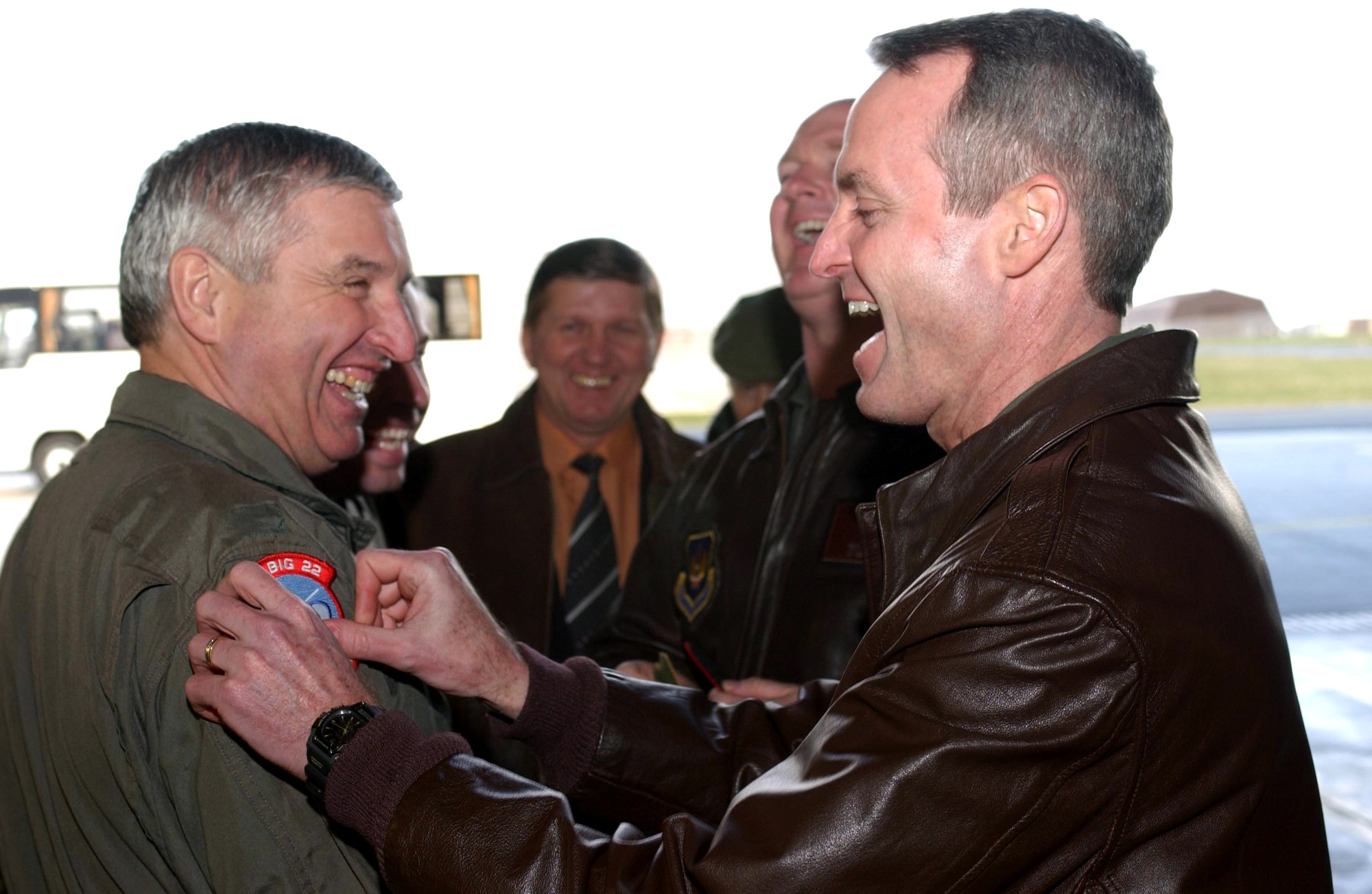 Col. Darryl Roberson, 52nd Fighter Wing commander, pins a 22nd Fighter Squadron patch on distinguished visitor Russian Gen. Maj. Aleksandr Kharchevsky March 20 at Spangdahlem Air Base, Germany. It is the day before the general's incentive flight. (U.S. Air Force photo/Airman 1st Class Stephanie Clark)