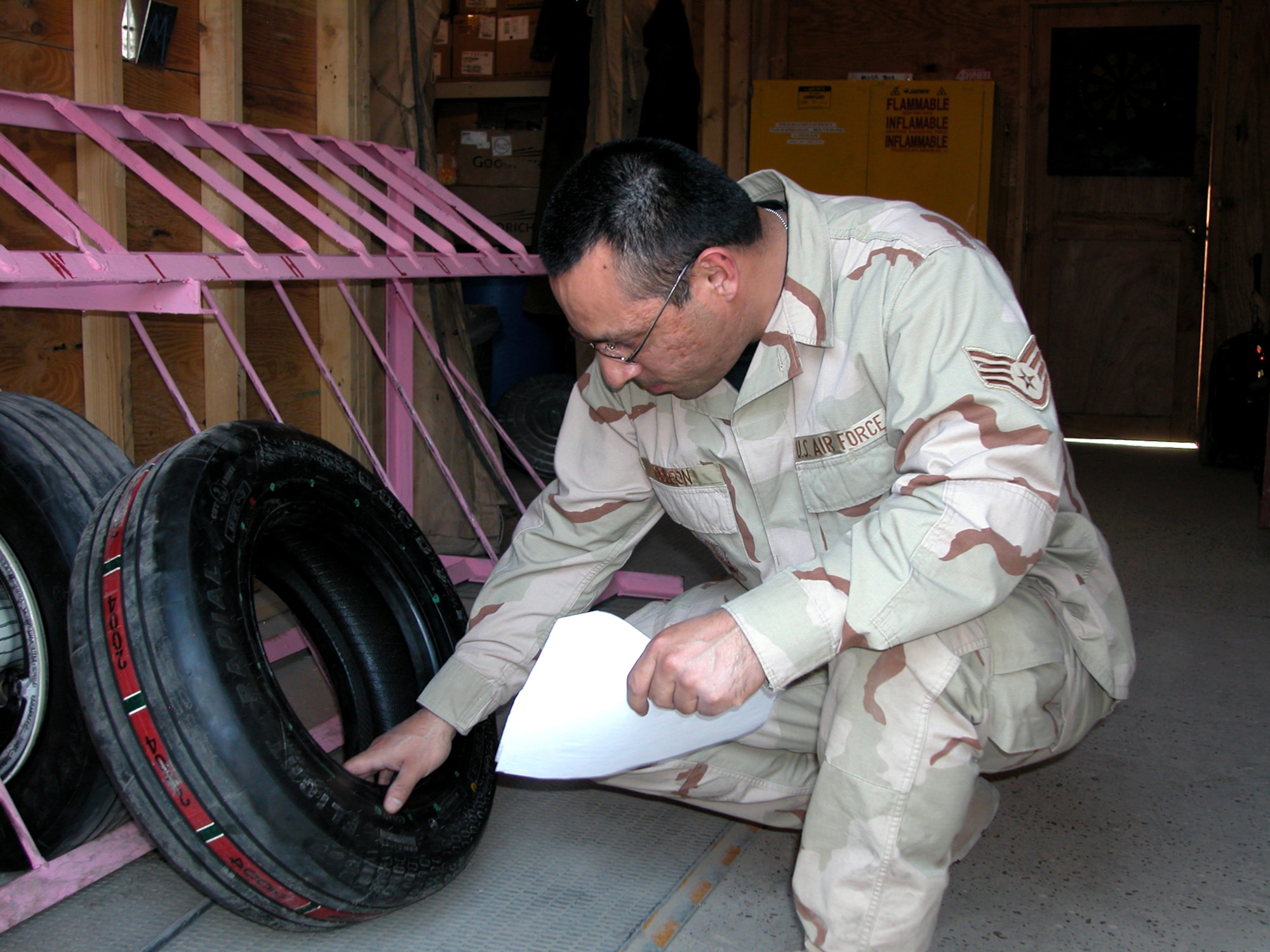 Staff Sgt. Ernest DeLeon checks an F-16 Fighting Falcon tire in the 332nd Expeditionary Maintenance Squadron's Crash Recovery, Wheel and Tire shop at Balad Air Base, Iraq.  Airmen in the shop work on about 30 wheels a week.  Sergeant DeLeon is deployed from the 35th Maintenance Squadron, Misawa Air Base, Japan. (U.S. Air Force photo/Master Sgt. Bryan Ripple)