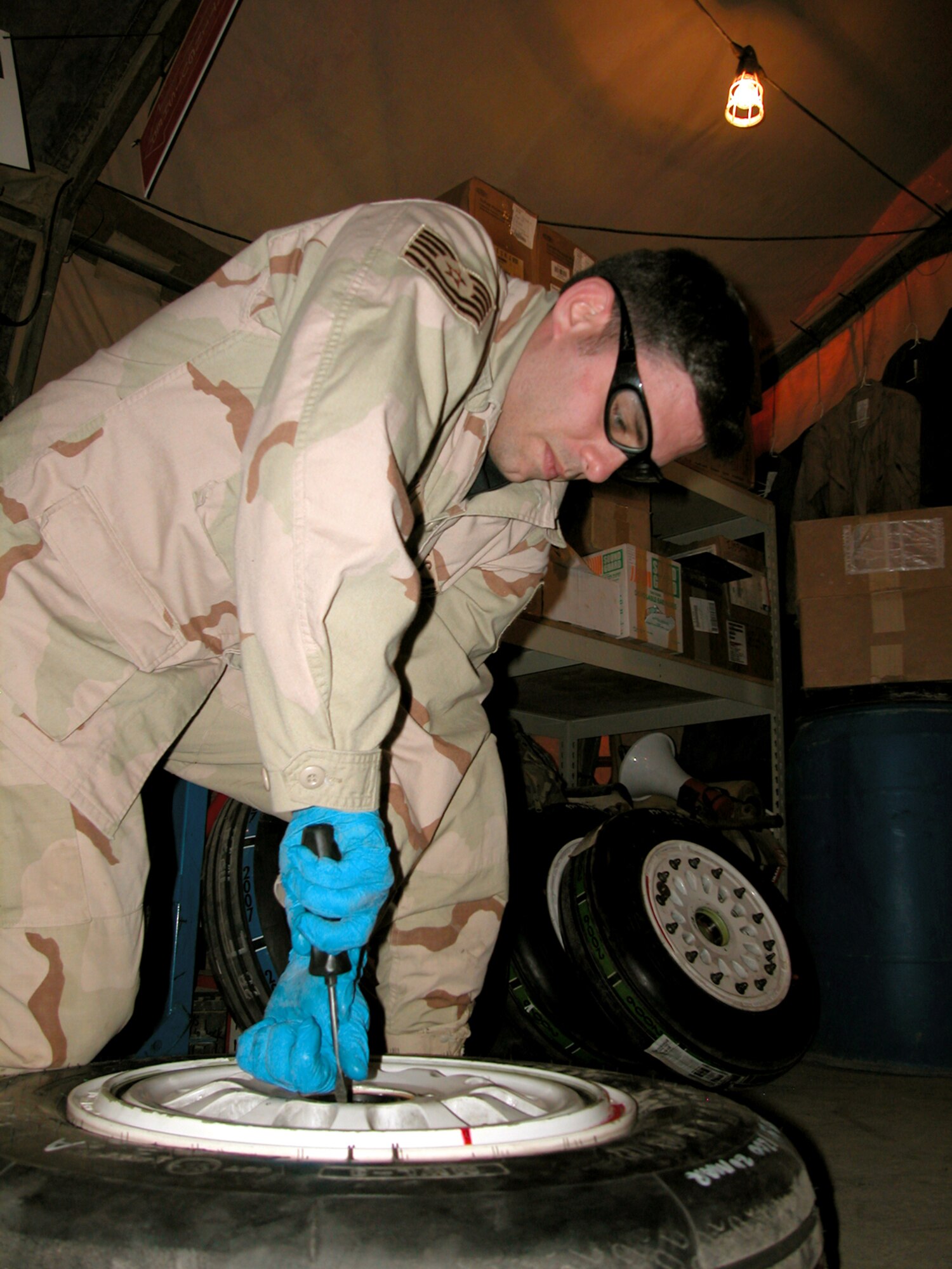 Tech. Sgt. James Marsili works on an F-16 Fighting Falcon wheel in the 332nd Expeditionary Maintenance Squadron's Crash Recovery, Wheel and Tire shop at Balad Air Base, Iraq.  Airmen in the shop work on about 30 wheels a week. Sergeant Marsili is deployed from the 366th Aircraft Maintenance Squadron, Mountain Home Air Force Base, Idaho. (U.S. Air Force photo/Master Sgt. Bryan Ripple) 