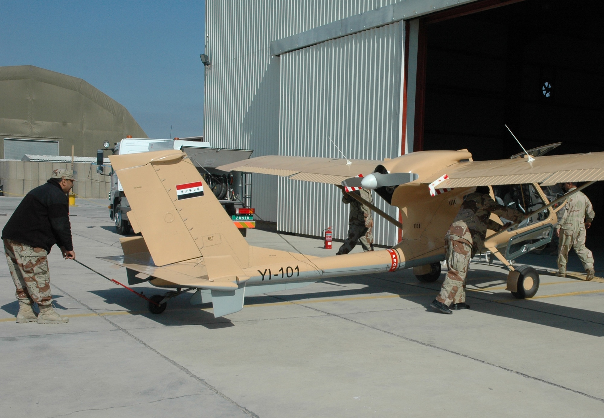 Iraqi airmen from Squadron 70 at Basra Air Base recover one of two Seeker aircraft after a mission. Squadron 70 flies intelligence, surveillance and reconnaissance missions over oil pipelines and other areas of interest, all the while keeping an eye out for insurgent activity. (U.S. Air Force photo/Tech. Sgt. Kevin Williams) 

