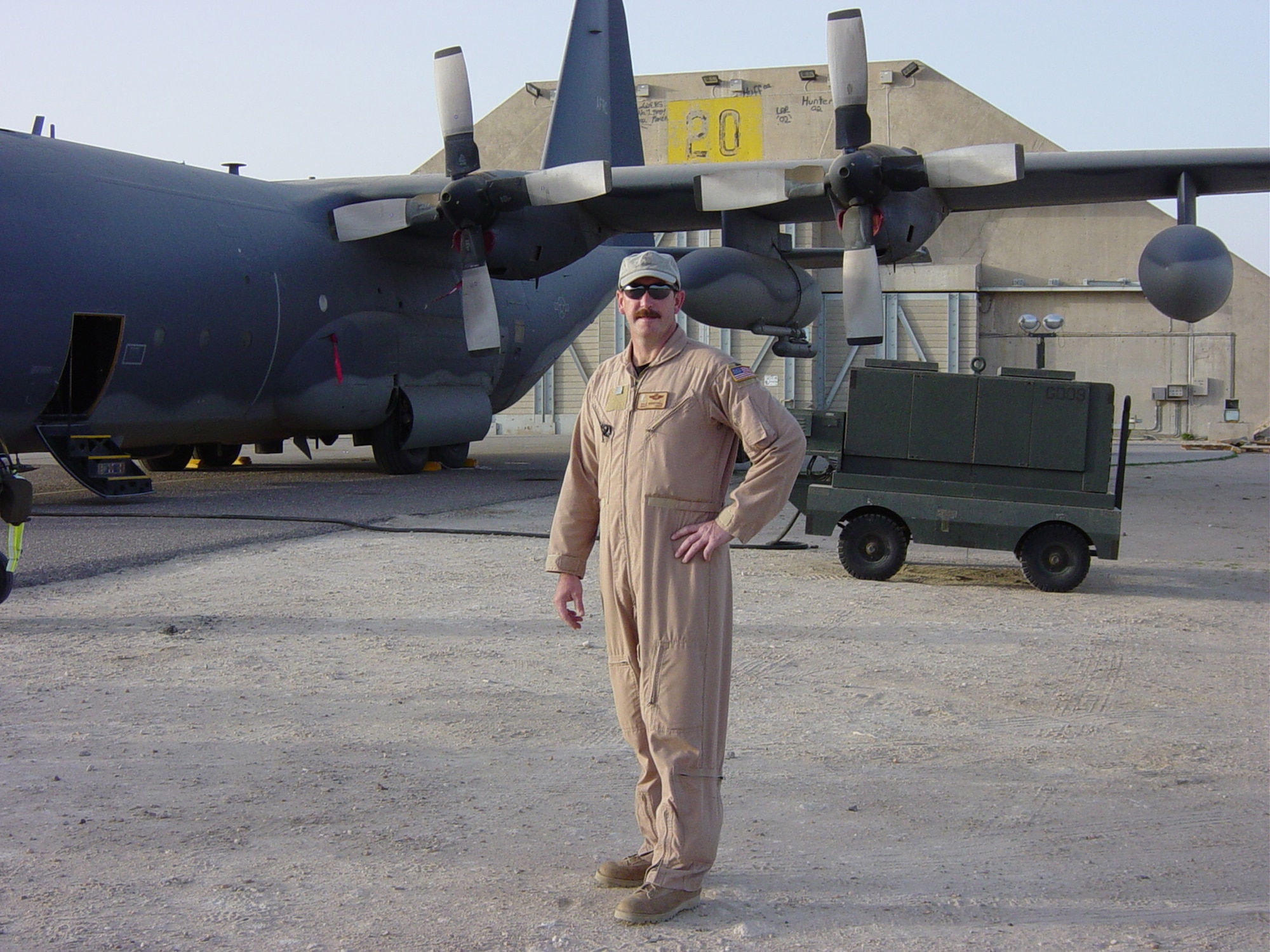 Senior Master Sgt. Dale P. Berryhill poses next to an aircraft while deployed to Iraq. (U.S. Air Force file photo)                           