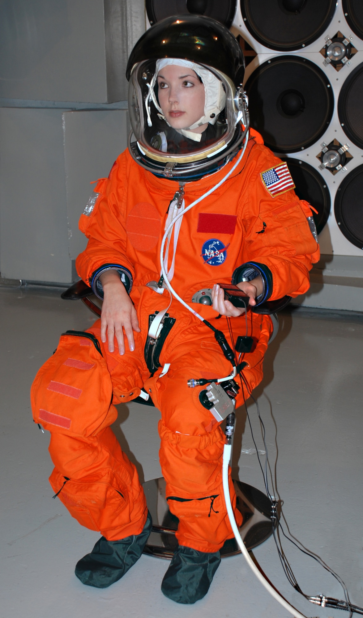 Wearing a NASA advanced crew escape suit, test subject Beth Greschner of General Dynamics Advanced Information Systems participates in an Air Force Research Laboratory study of a new communications system for space shuttle astronauts.